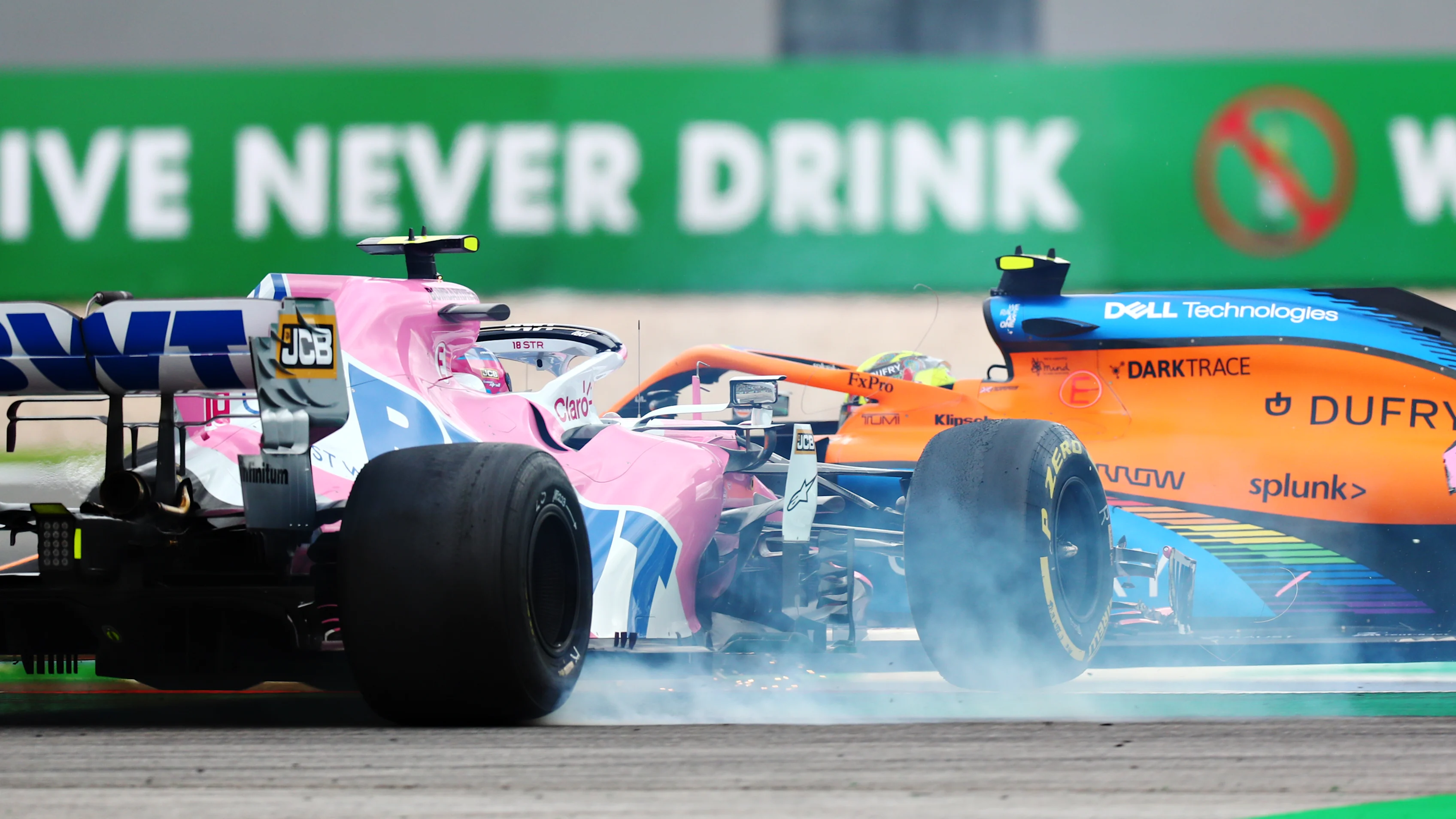 PORTIMAO, PORTUGAL - OCTOBER 25: Lance Stroll of Canada driving the (18) Racing Point RP20 Mercedes and Lando Norris of Great Britain driving the (4) McLaren F1 Team MCL35 Renault crash during the F1 Grand Prix of Portugal at Autodromo Internacional do Algarve on October 25, 2020 in Portimao, Portugal. (Photo by Dan Istitene - Formula 1/Formula 1 via Getty Images)