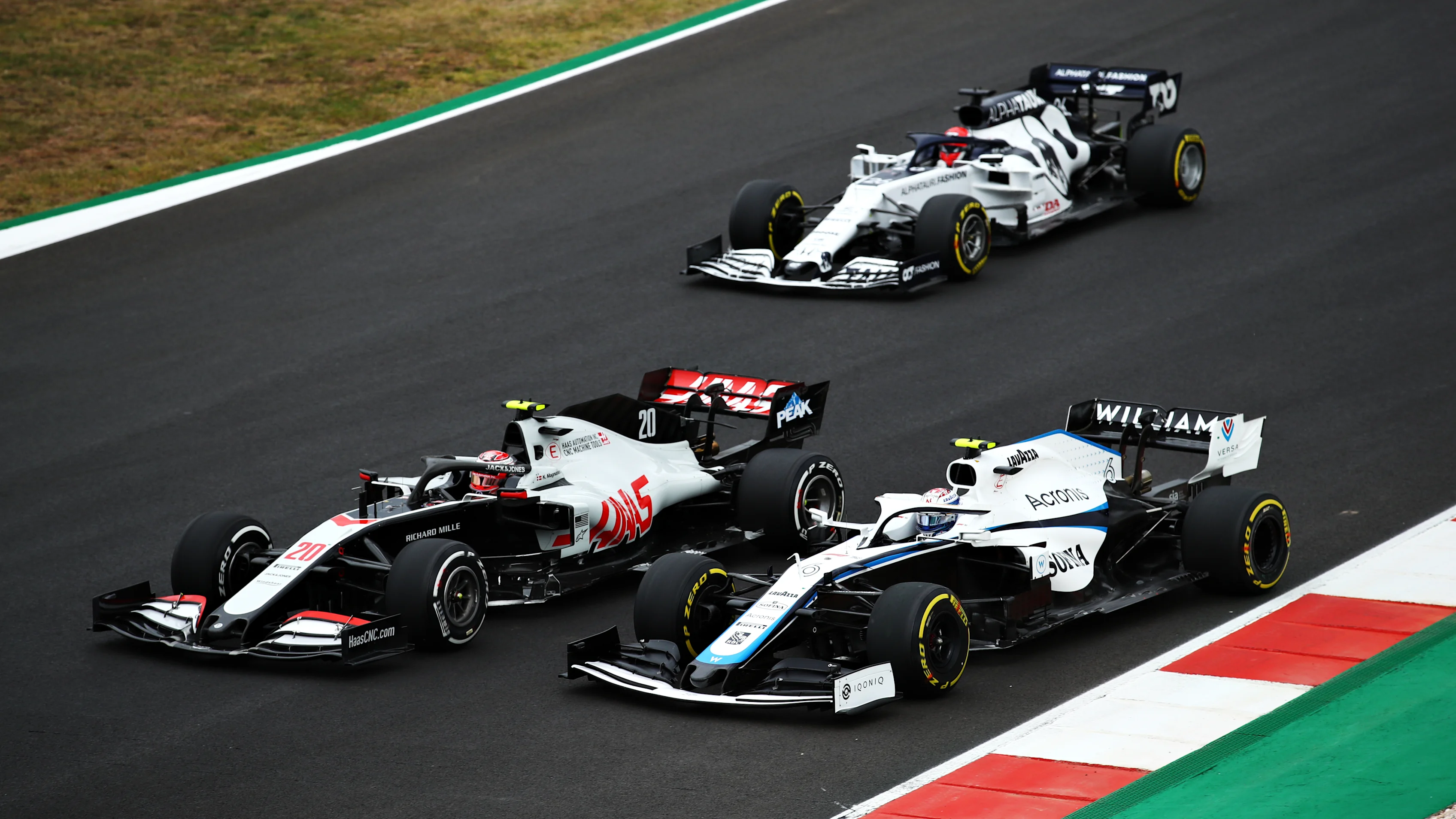 PORTIMAO, PORTUGAL - OCTOBER 25: Kevin Magnussen of Denmark driving the (20) Haas F1 Team VF-20 Ferrari battles for position with Nicholas Latifi of Canada driving the (6) Williams Racing FW43 Mercedes during the F1 Grand Prix of Portugal at Autodromo Internacional do Algarve on October 25, 2020 in Portimao, Portugal. (Photo by Bryn Lennon - Formula 1/Formula 1 via Getty Images)