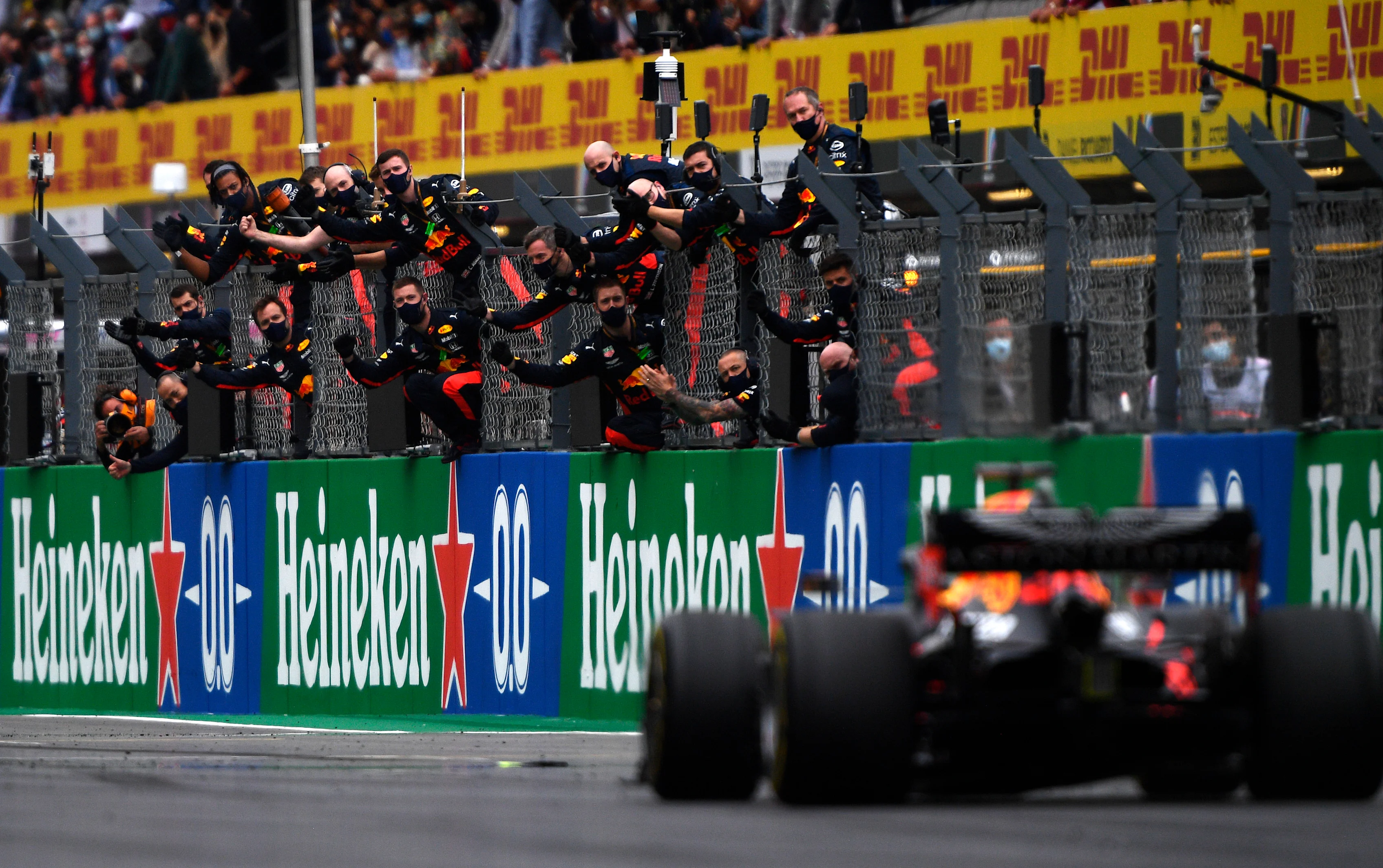 PORTIMAO, PORTUGAL - OCTOBER 25: The Red Bull Racing team celebrate on the pitwall as third placed