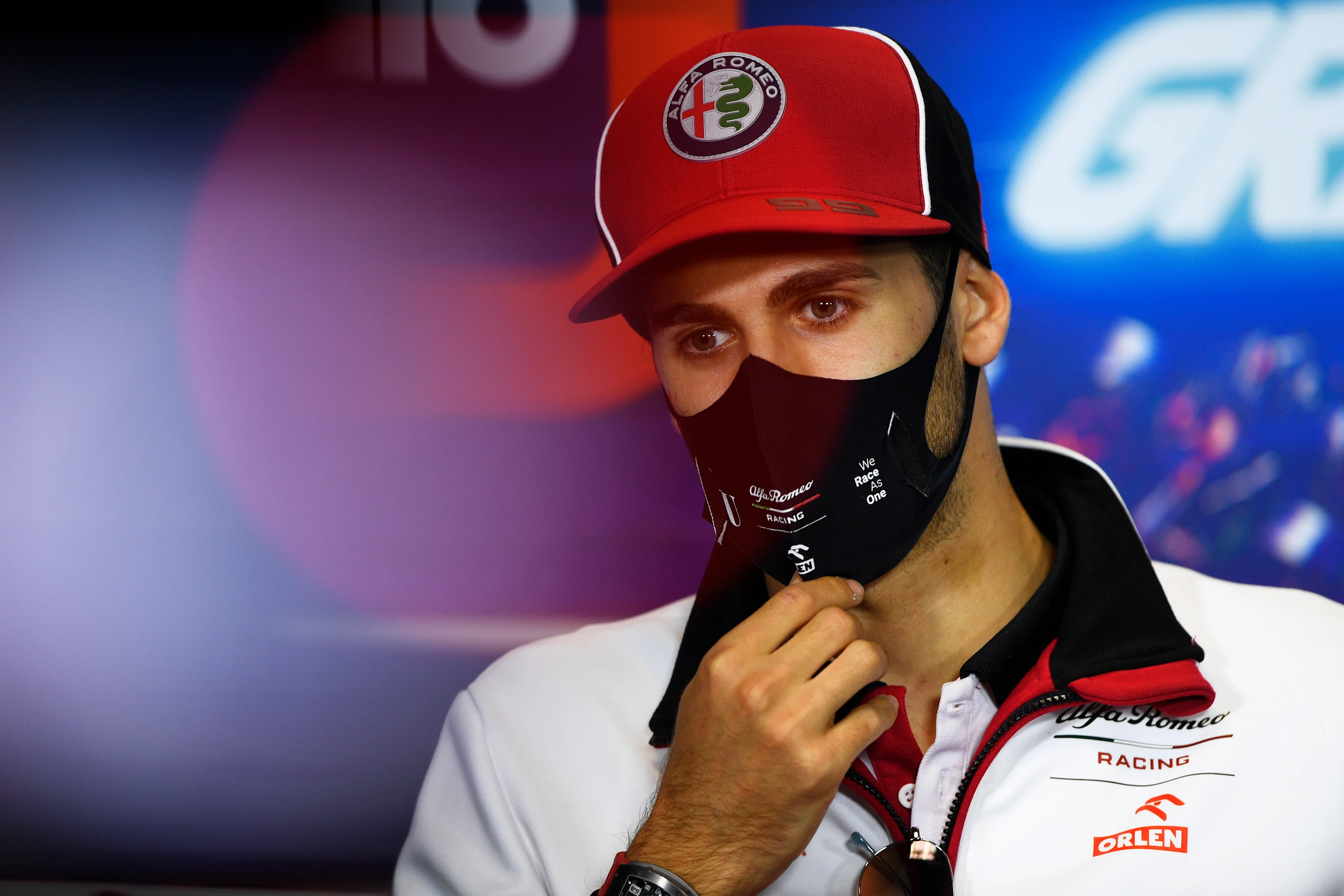 PORTIMAO, PORTUGAL - OCTOBER 22: Antonio Giovinazzi of Italy and Alfa Romeo Racing talks in the