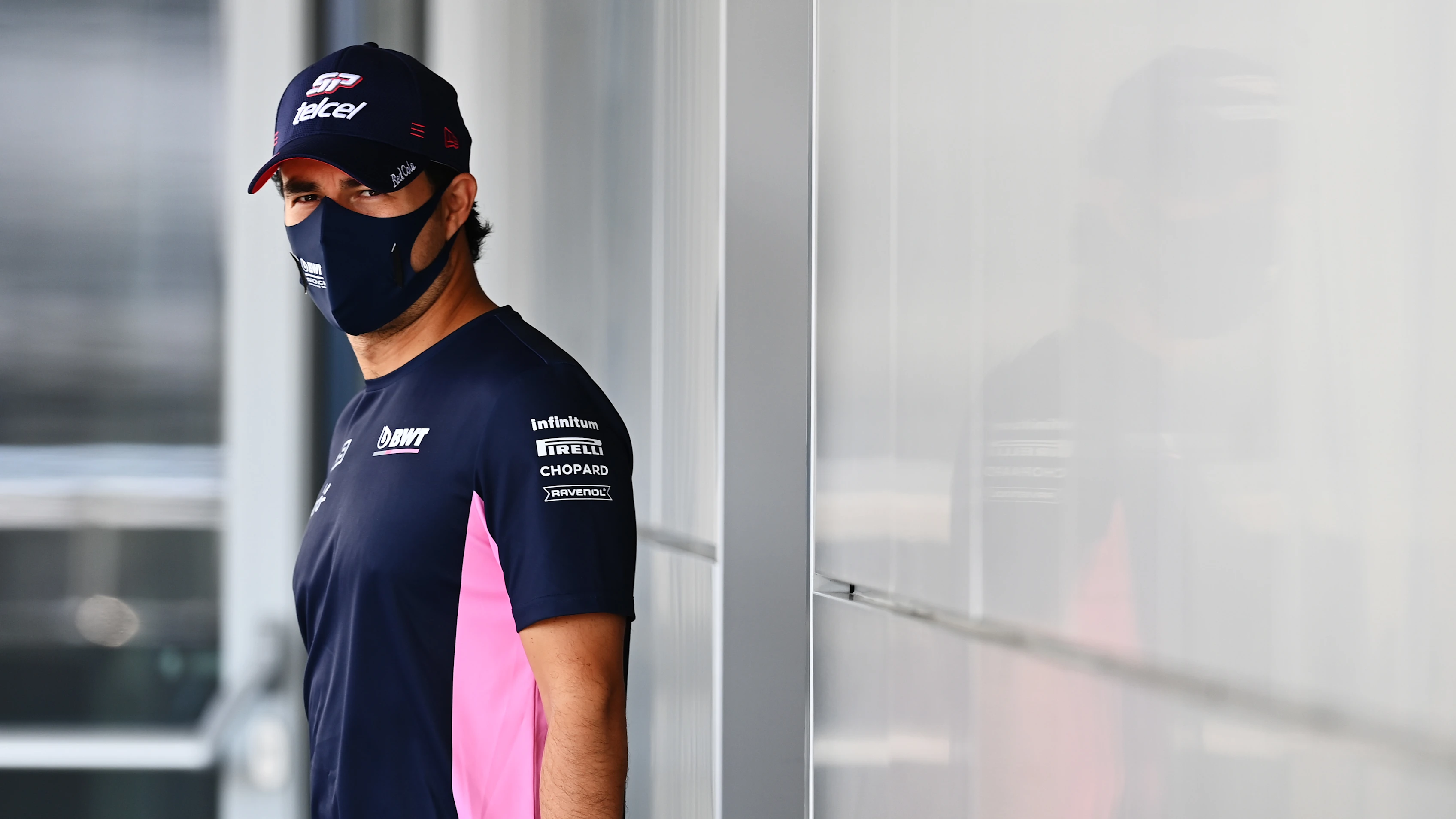 SOCHI, RUSSIA - SEPTEMBER 24: Sergio Perez of Mexico and Racing Point walks in the Paddock during