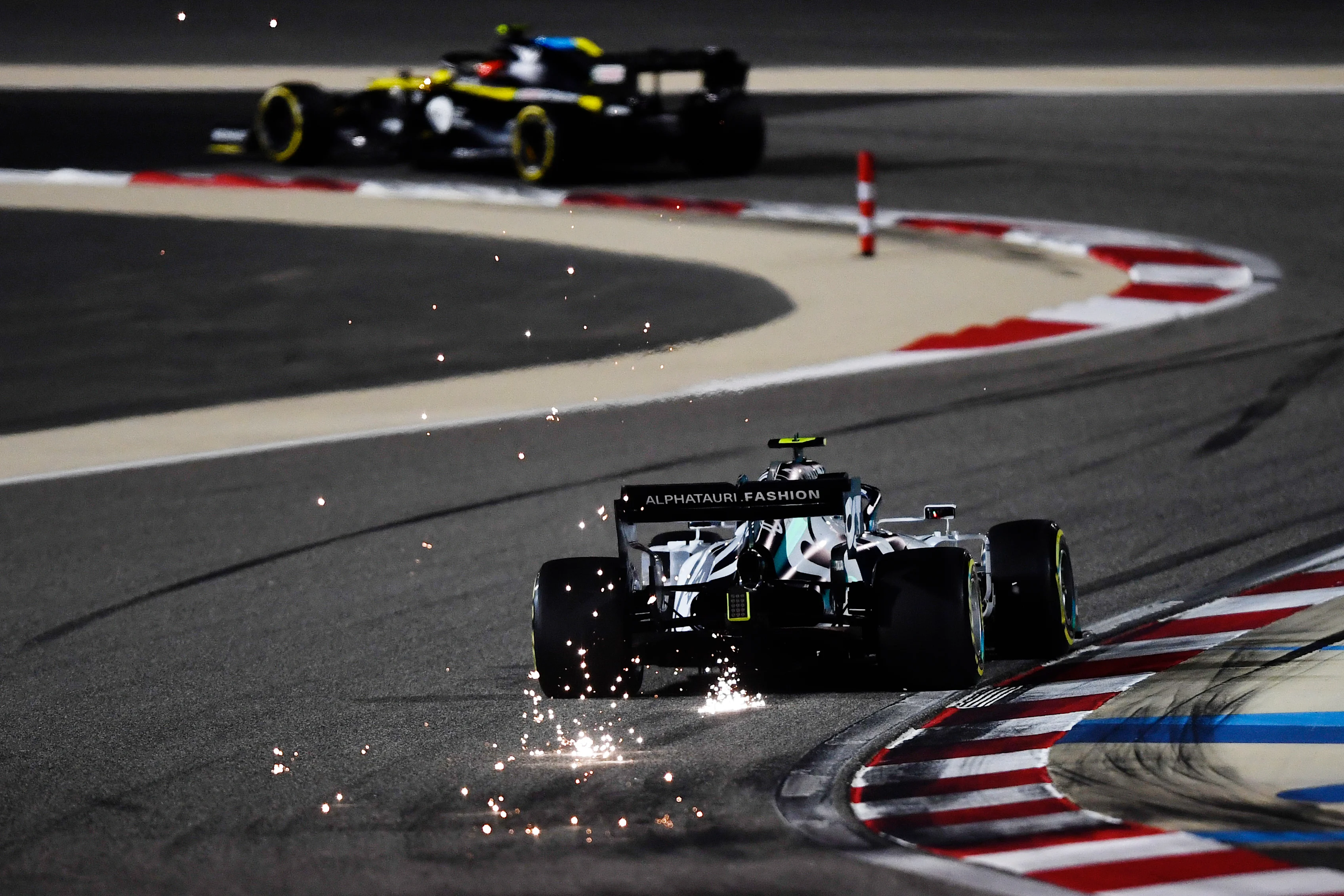 BAHRAIN, BAHRAIN - DECEMBER 04: Sparks fly behind Pierre Gasly of France driving the (10) Scuderia