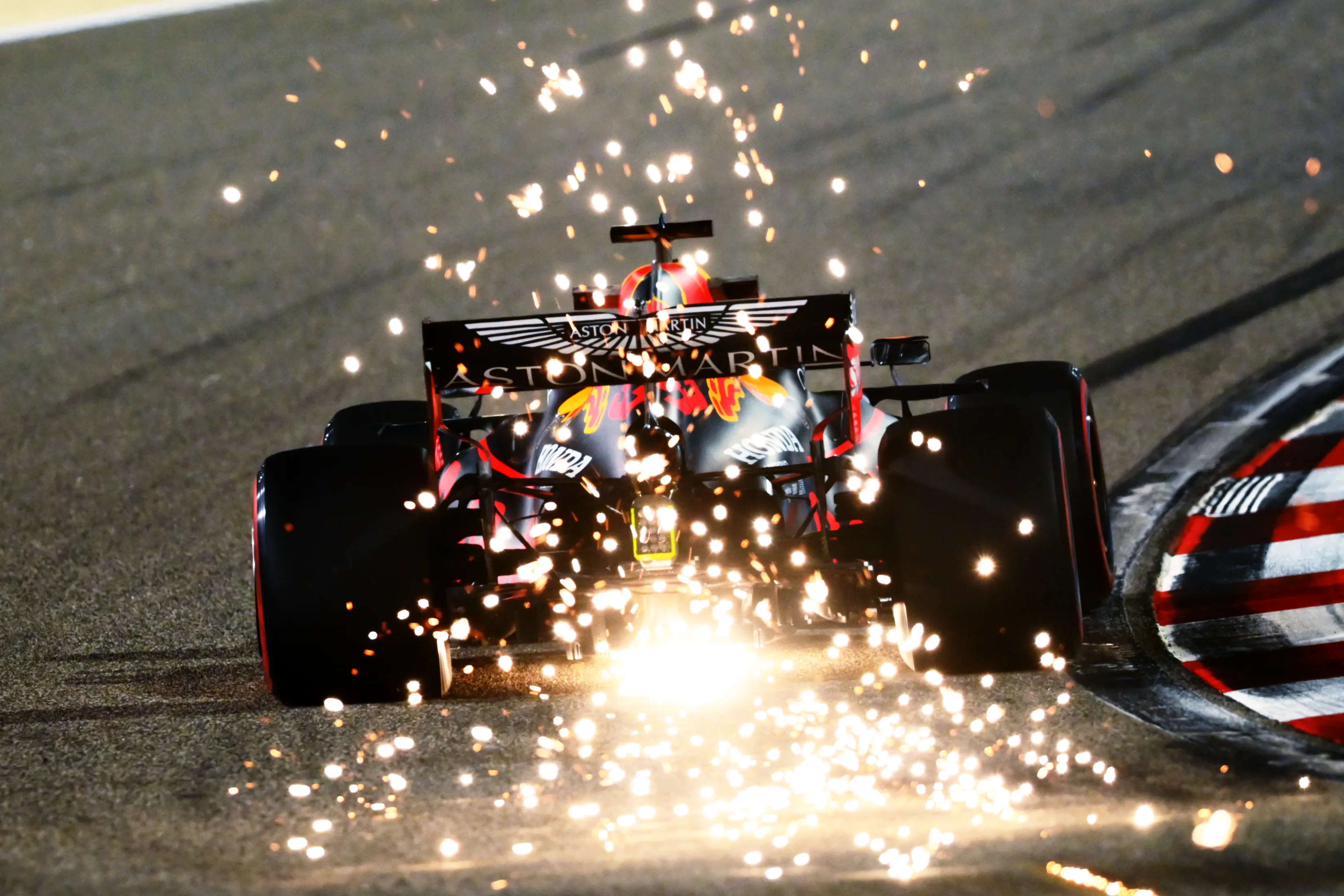 BAHRAIN, BAHRAIN - DECEMBER 04: Sparks fly behind Max Verstappen of the Netherlands driving the (33) Aston Martin Red Bull Racing RB16 during practice ahead of the F1 Grand Prix of Sakhir at Bahrain International Circuit on December 04, 2020 in Bahrain, Bahrain. (Photo by Clive Mason - Formula 1/Formula 1 via Getty Images)
