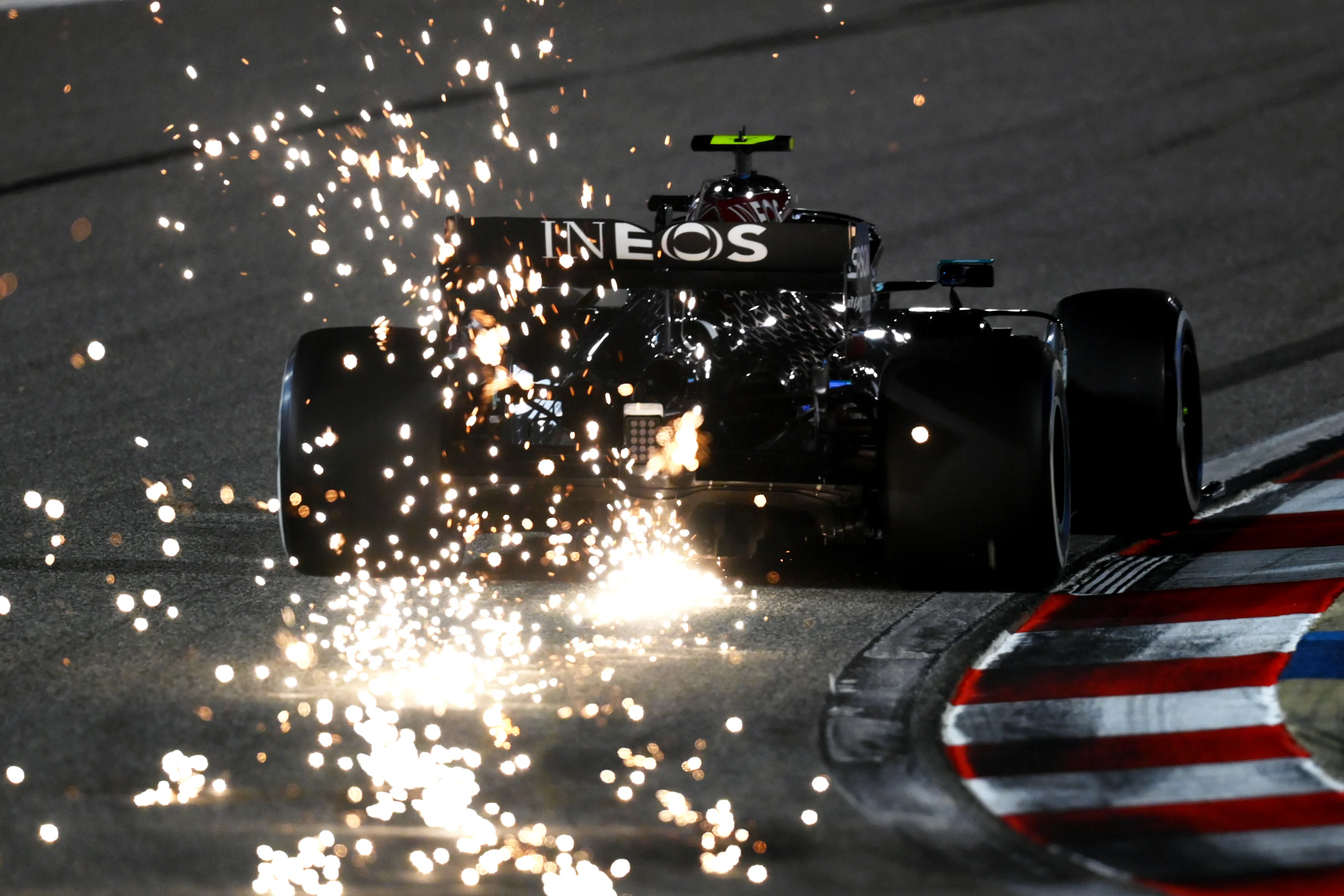 BAHRAIN, BAHRAIN - DECEMBER 04: Sparks fly behind Valtteri Bottas of Finland driving the (77)