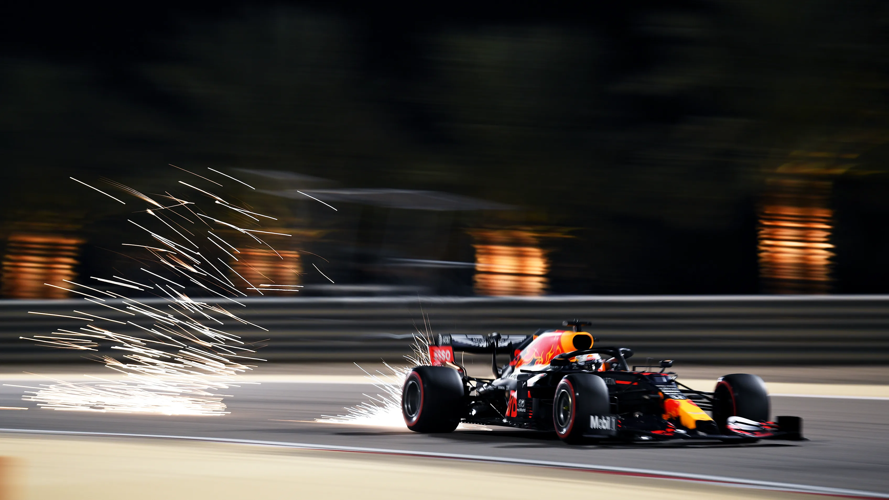 BAHRAIN, BAHRAIN - DECEMBER 05: Sparks fly behind Max Verstappen of the Netherlands driving the