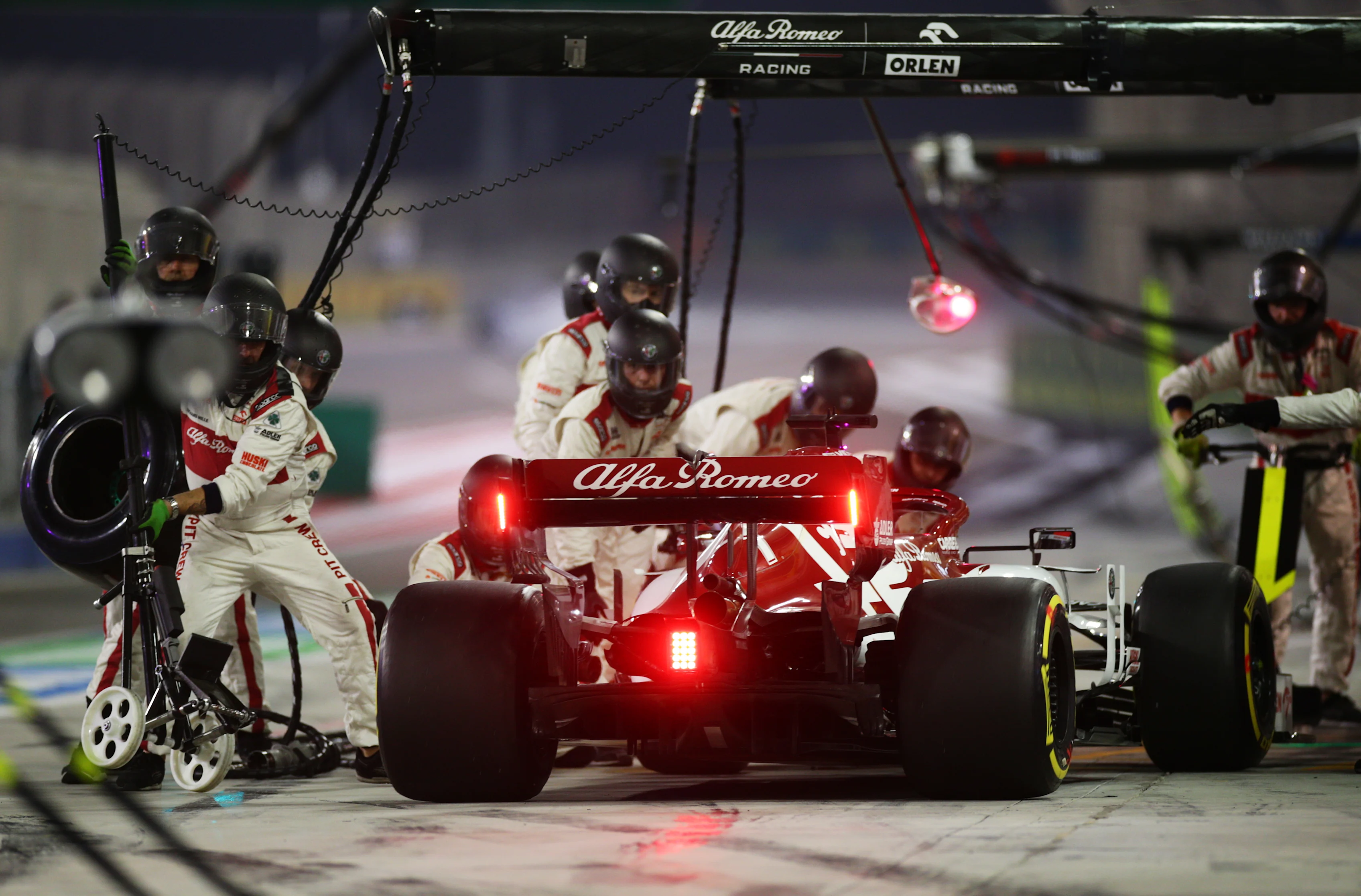 BAHRAIN, BAHRAIN - DECEMBER 06: Kimi Raikkonen of Finland driving the (7) Alfa Romeo Racing C39 Ferrari makes a pitstop during the F1 Grand Prix of Sakhir at Bahrain International Circuit on December 06, 2020 in Bahrain, Bahrain. (Photo by Peter Fox/Getty Images)
