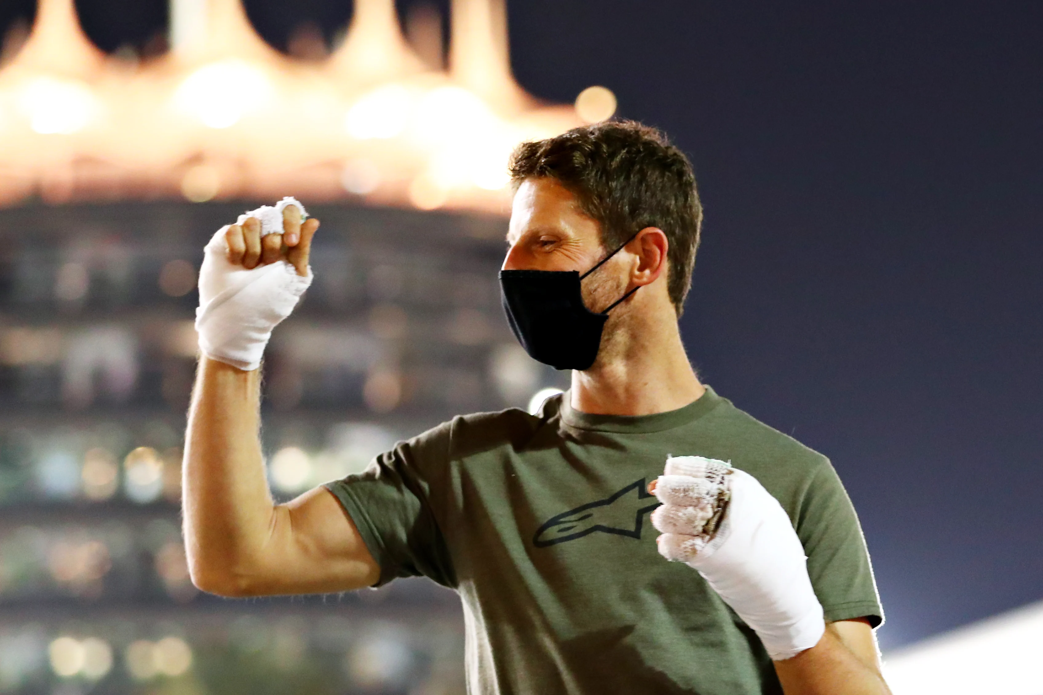 BAHRAIN, BAHRAIN - DECEMBER 03: Romain Grosjean of France and Haas F1 walks in the Paddock with