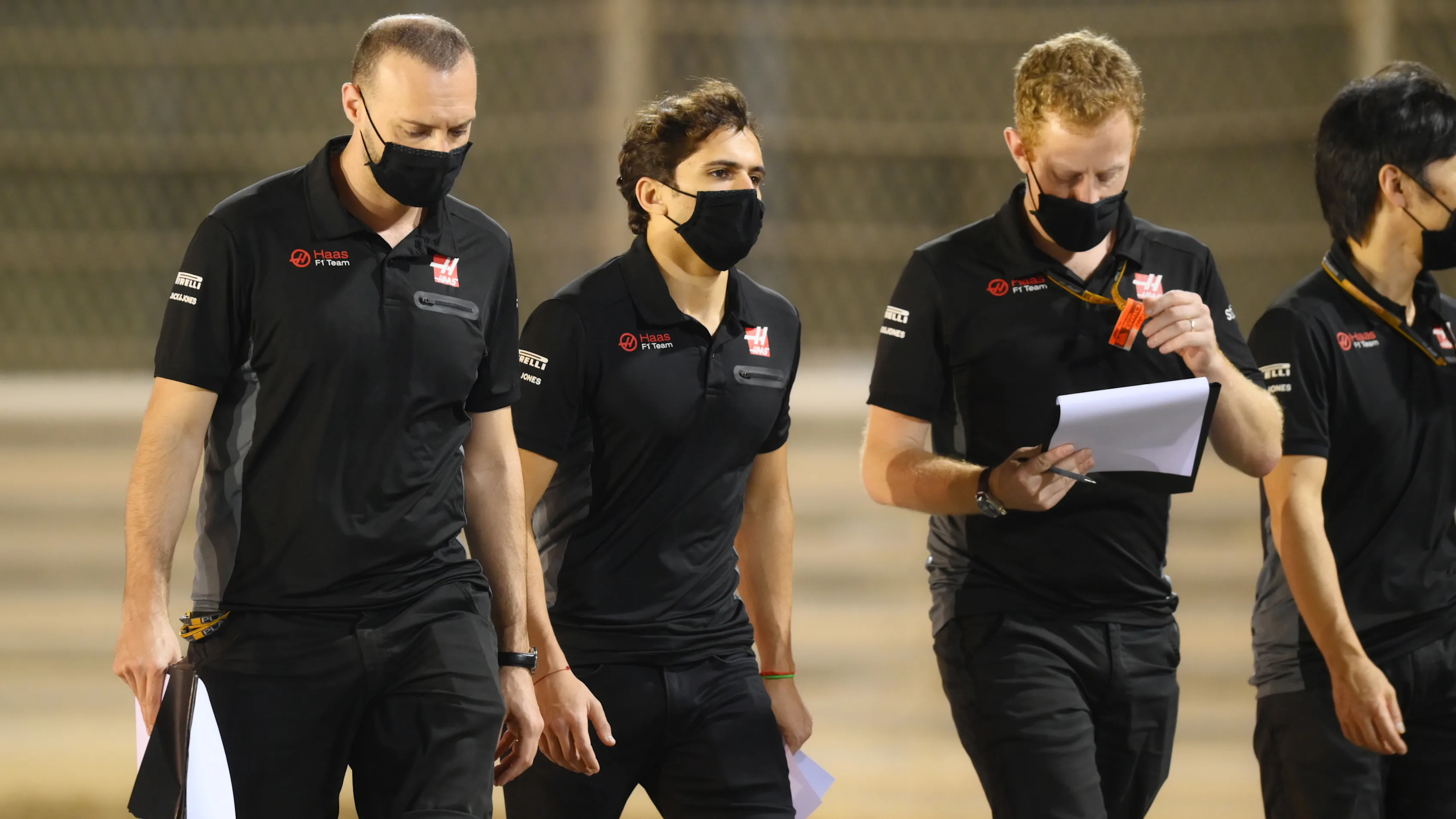 BAHRAIN, BAHRAIN - DECEMBER 03: Pietro Fittipaldi of Brazil and Haas F1 walks the track with his