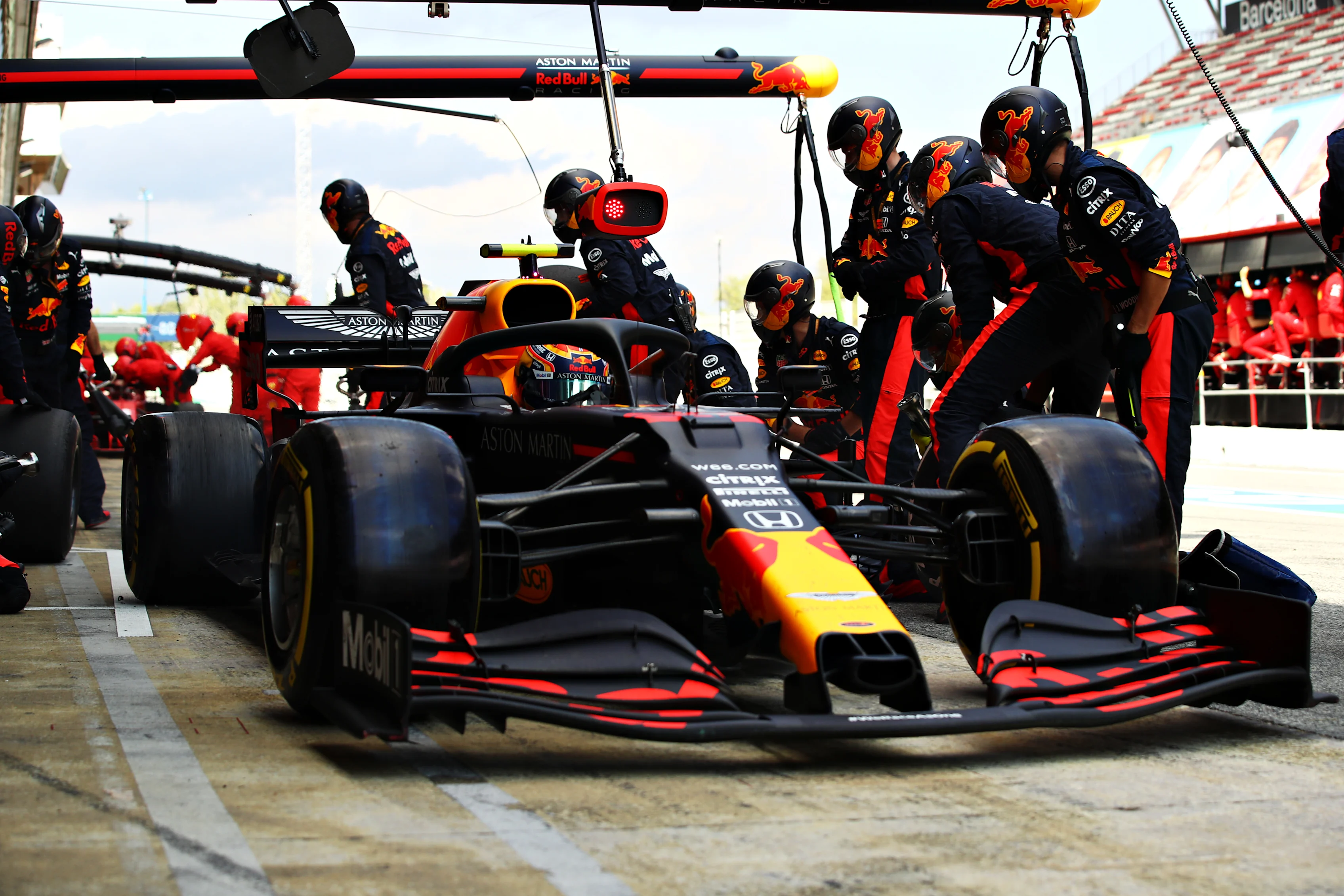 BARCELONA, SPAIN - AUGUST 16: Alexander Albon of Thailand driving the (23) Aston Martin Red Bull Racing RB16 makes a pitstop during the F1 Grand Prix of Spain at Circuit de Barcelona-Catalunya on August 16, 2020 in Barcelona, Spain. (Photo by Mark Thompson/Getty Images)