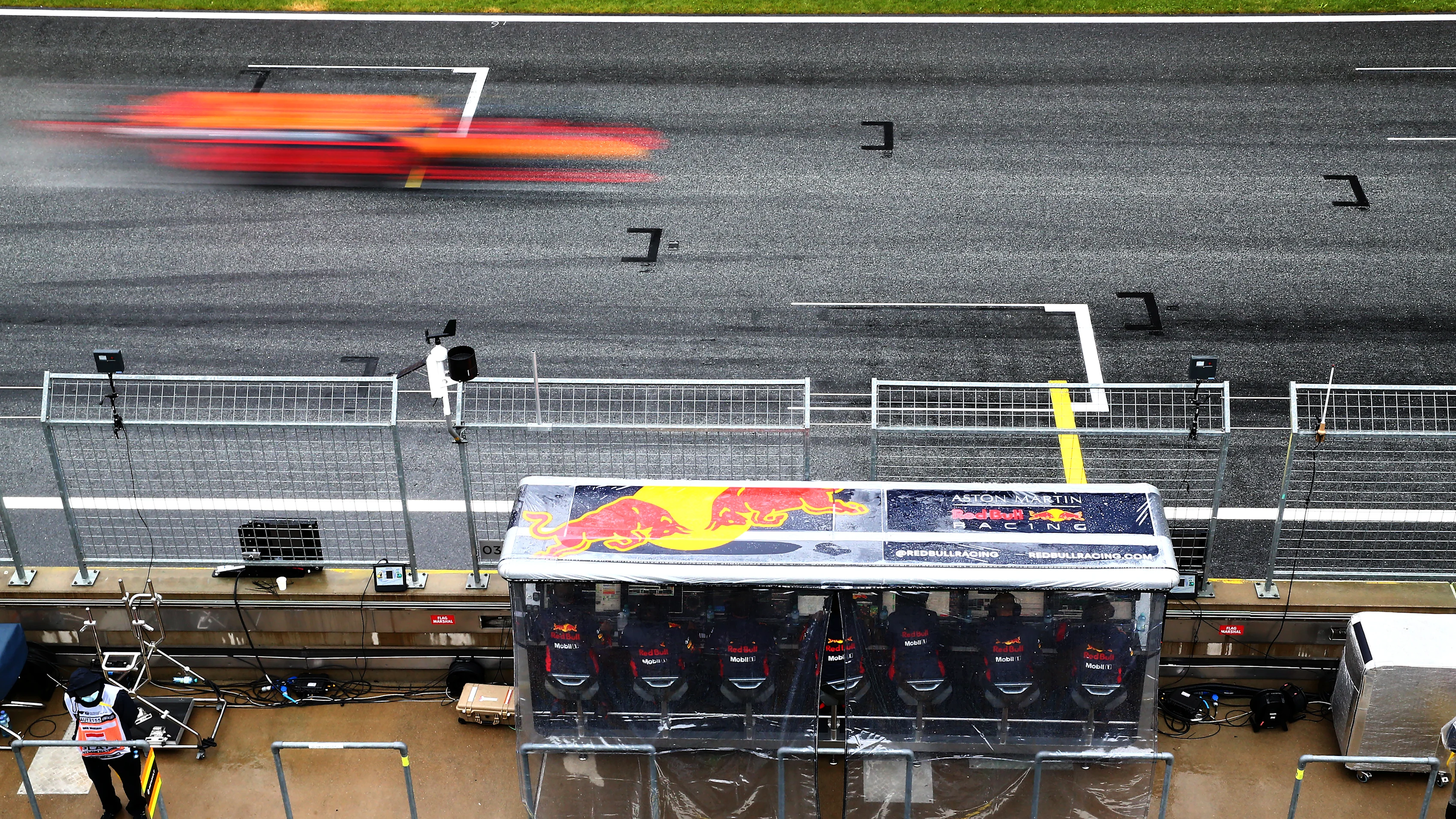 SPIELBERG, AUSTRIA - JULY 11: The Red Bull Racing pitwall looks on as Max Verstappen of the