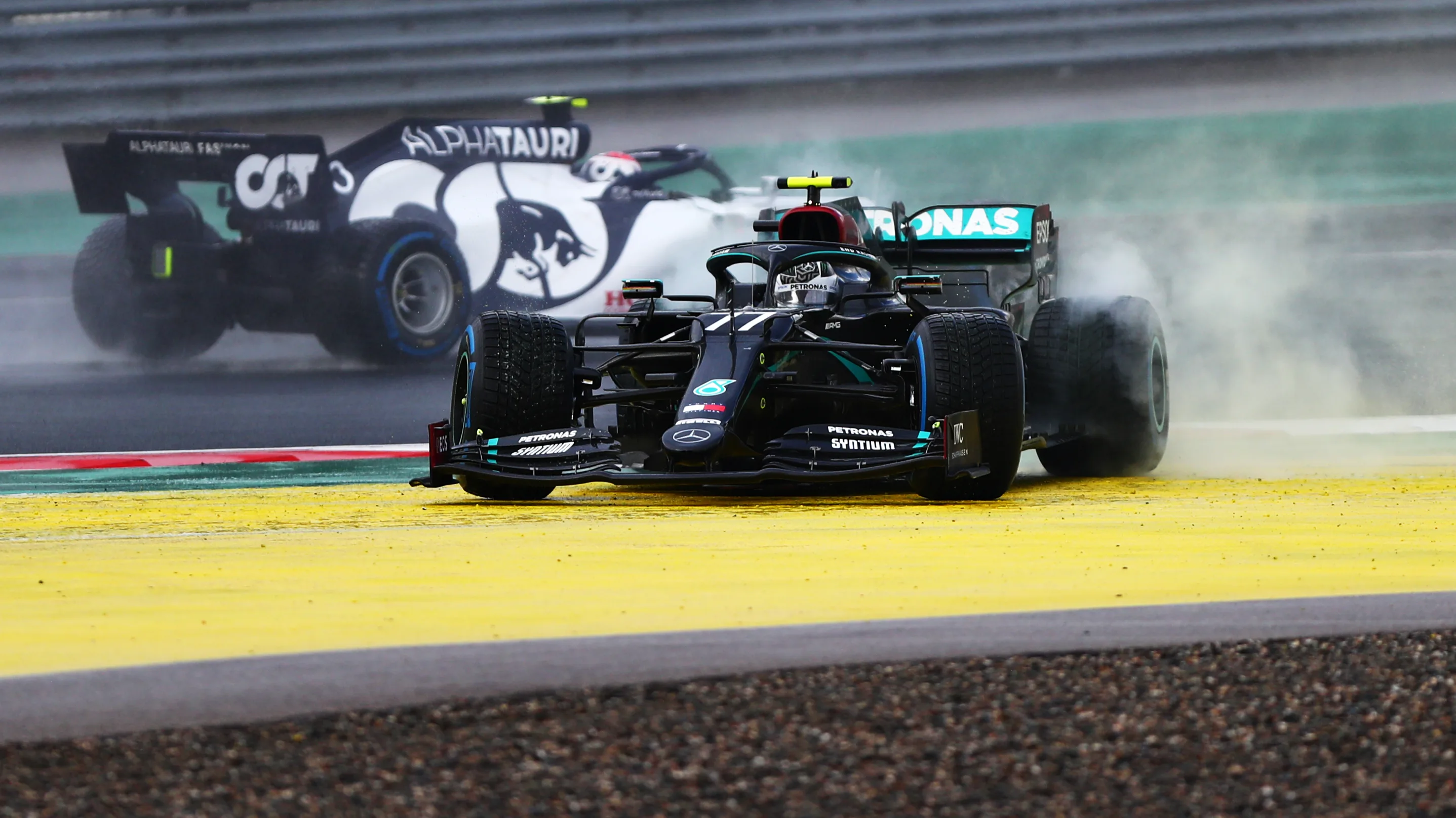 ISTANBUL, TURKEY - NOVEMBER 15: Valtteri Bottas of Finland driving the (77) Mercedes AMG Petronas F1 Team Mercedes W11 spins at the start during the F1 Grand Prix of Turkey at Intercity Istanbul Park on November 15, 2020 in Istanbul, Turkey. (Photo by Dan Istitene - Formula 1/Formula 1 via Getty Images)