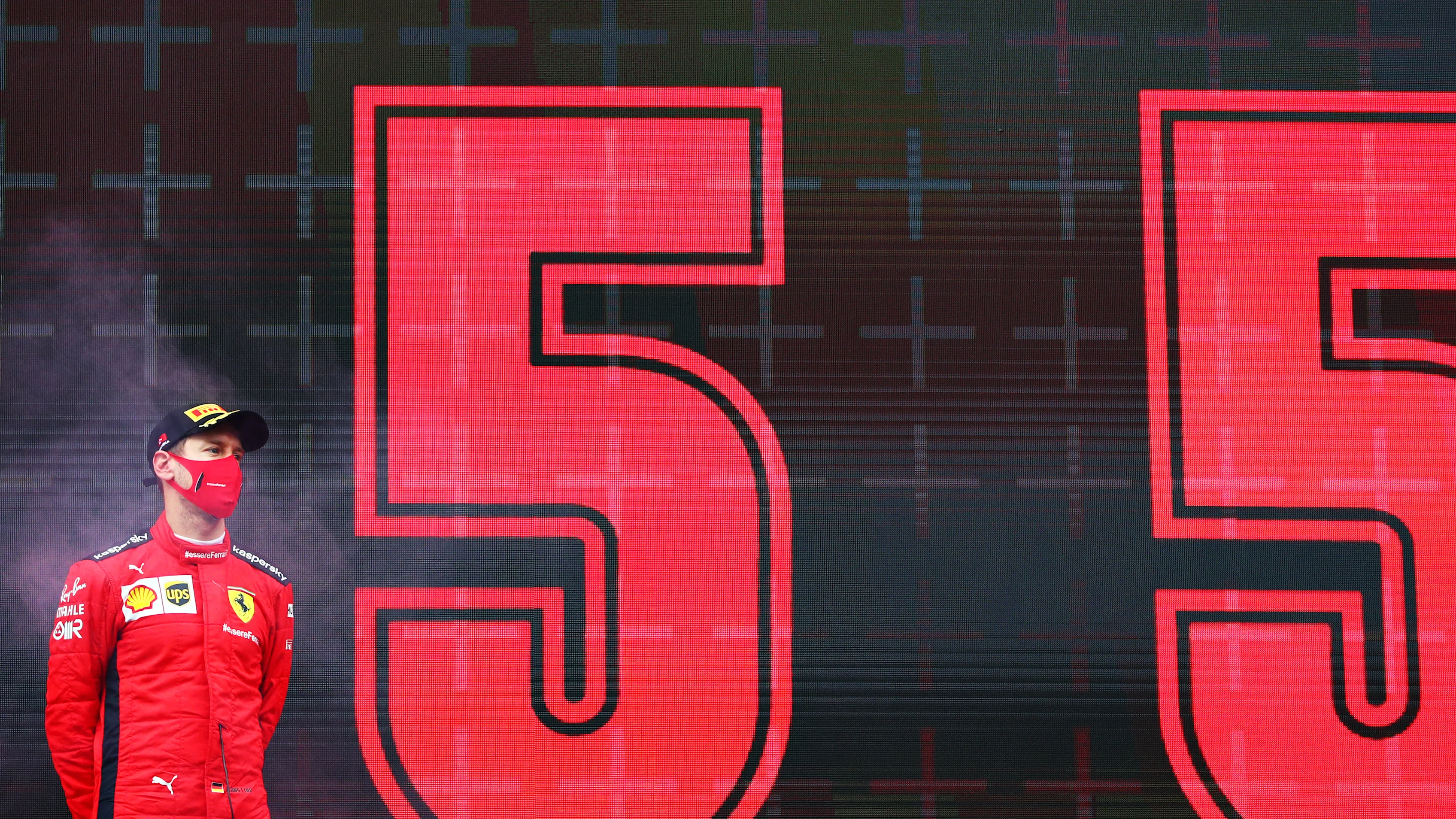 ISTANBUL, TURKEY - NOVEMBER 15: Third placed Sebastian Vettel of Germany and Ferrari stands on the