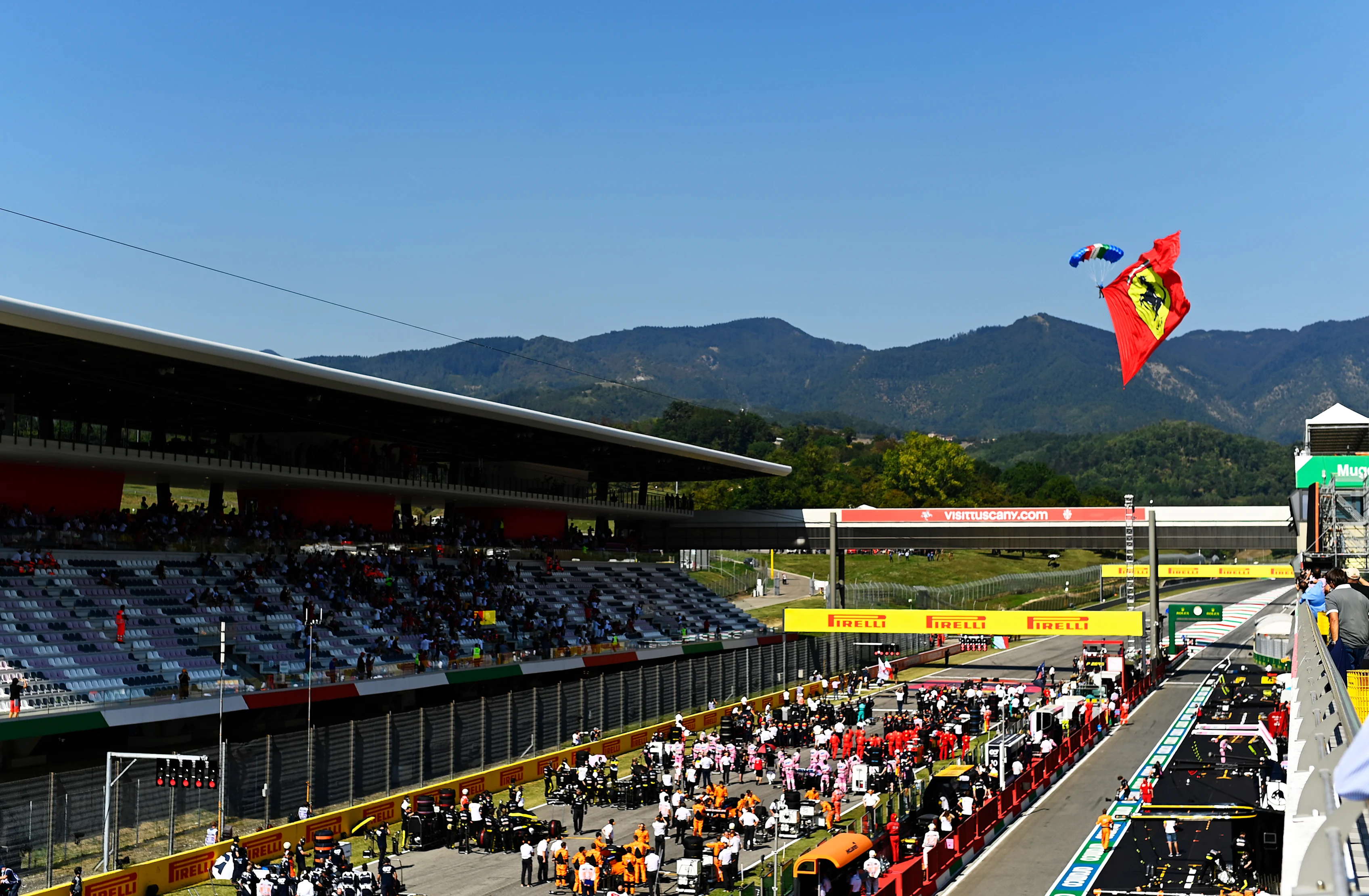 SCARPERIA, ITALY - SEPTEMBER 13: A parachutist flies with a Ferrari flag before the F1 Grand Prix