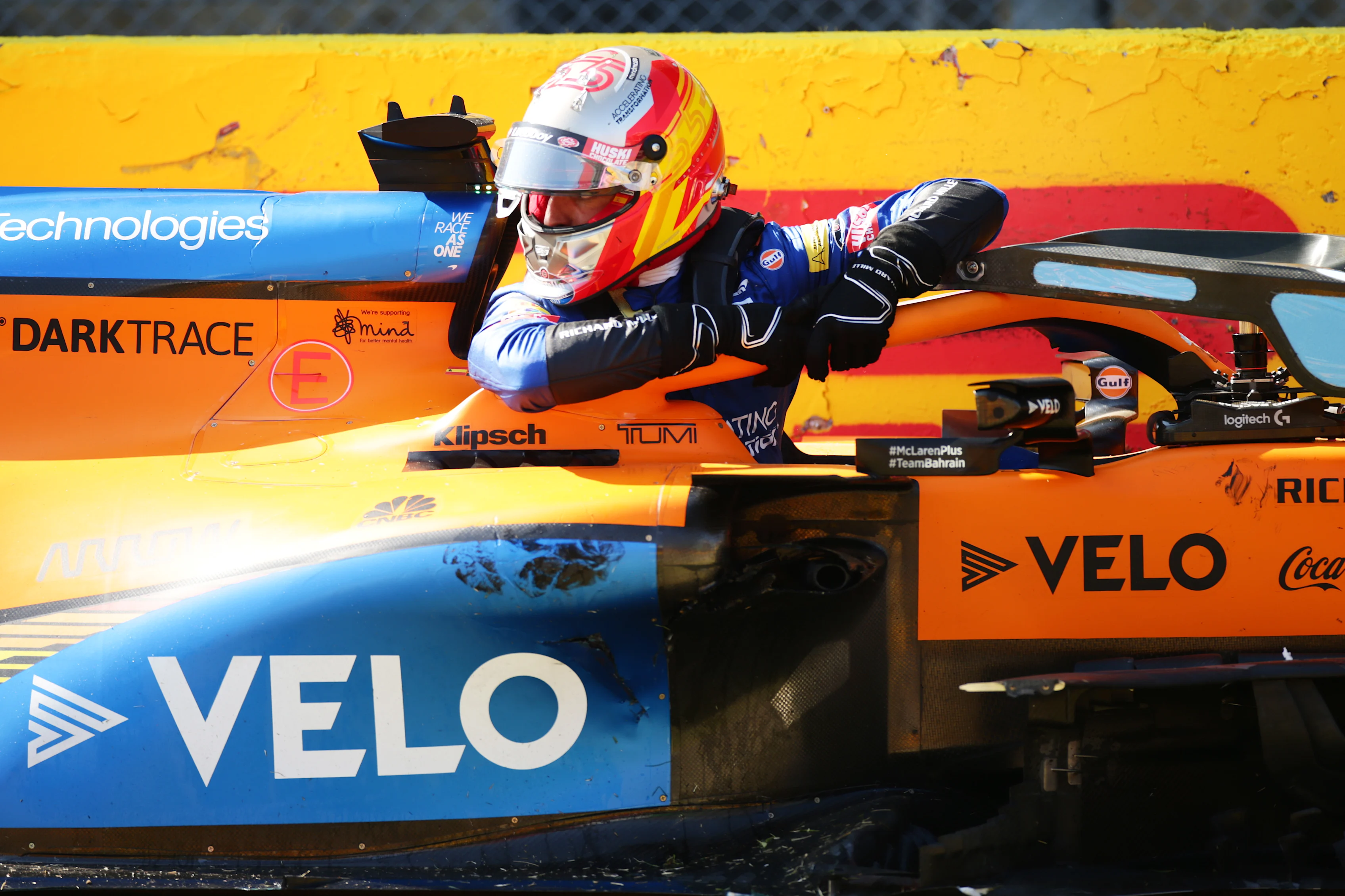 SCARPERIA, ITALY - SEPTEMBER 13: Carlos Sainz of Spain and McLaren F1 climbs out of his car after a collision during the F1 Grand Prix of Tuscany at Mugello Circuit on September 13, 2020 in Scarperia, Italy. (Photo by Peter Fox/Getty Images)