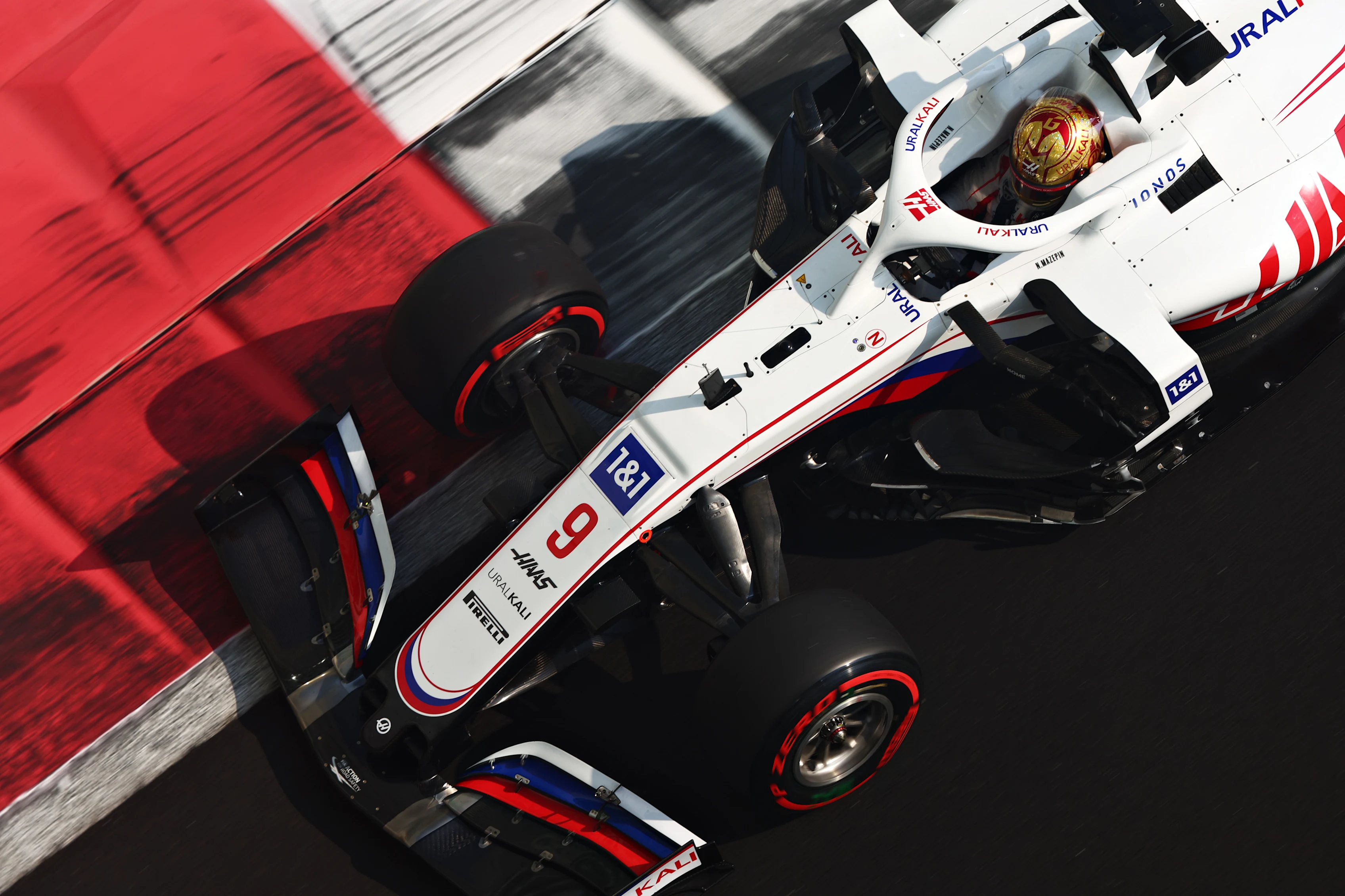 ABU DHABI, UNITED ARAB EMIRATES - DECEMBER 11: Nikita Mazepin of Russia driving the (9) Haas F1 Team VF-21 Ferrari during final practice ahead of the F1 Grand Prix of Abu Dhabi at Yas Marina Circuit on December 11, 2021 in Abu Dhabi, United Arab Emirates. (Photo by Mark Thompson/Getty Images)