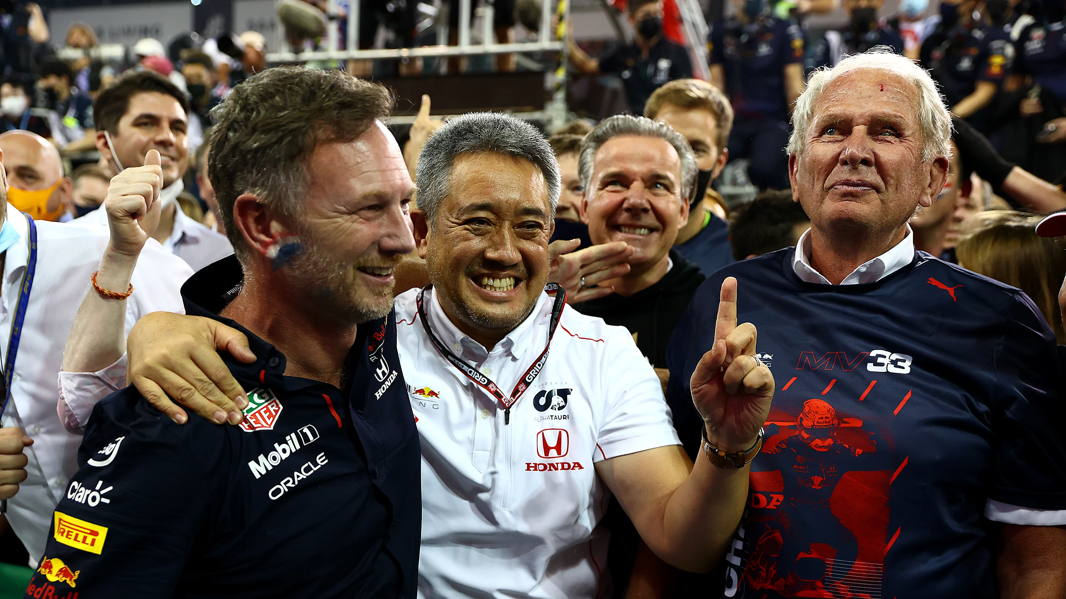 ABU DHABI, UNITED ARAB EMIRATES - DECEMBER 12: Red Bull Racing Team Principal Christian Horner, Masashi Yamamoto of Honda and Red Bull Racing Team Consultant Dr Helmut Marko celebrate in parc ferme during the F1 Grand Prix of Abu Dhabi at Yas Marina Circuit on December 12, 2021 in Abu Dhabi, United Arab Emirates. (Photo by Dan Istitene - Formula 1/Formula 1 via Getty Images)