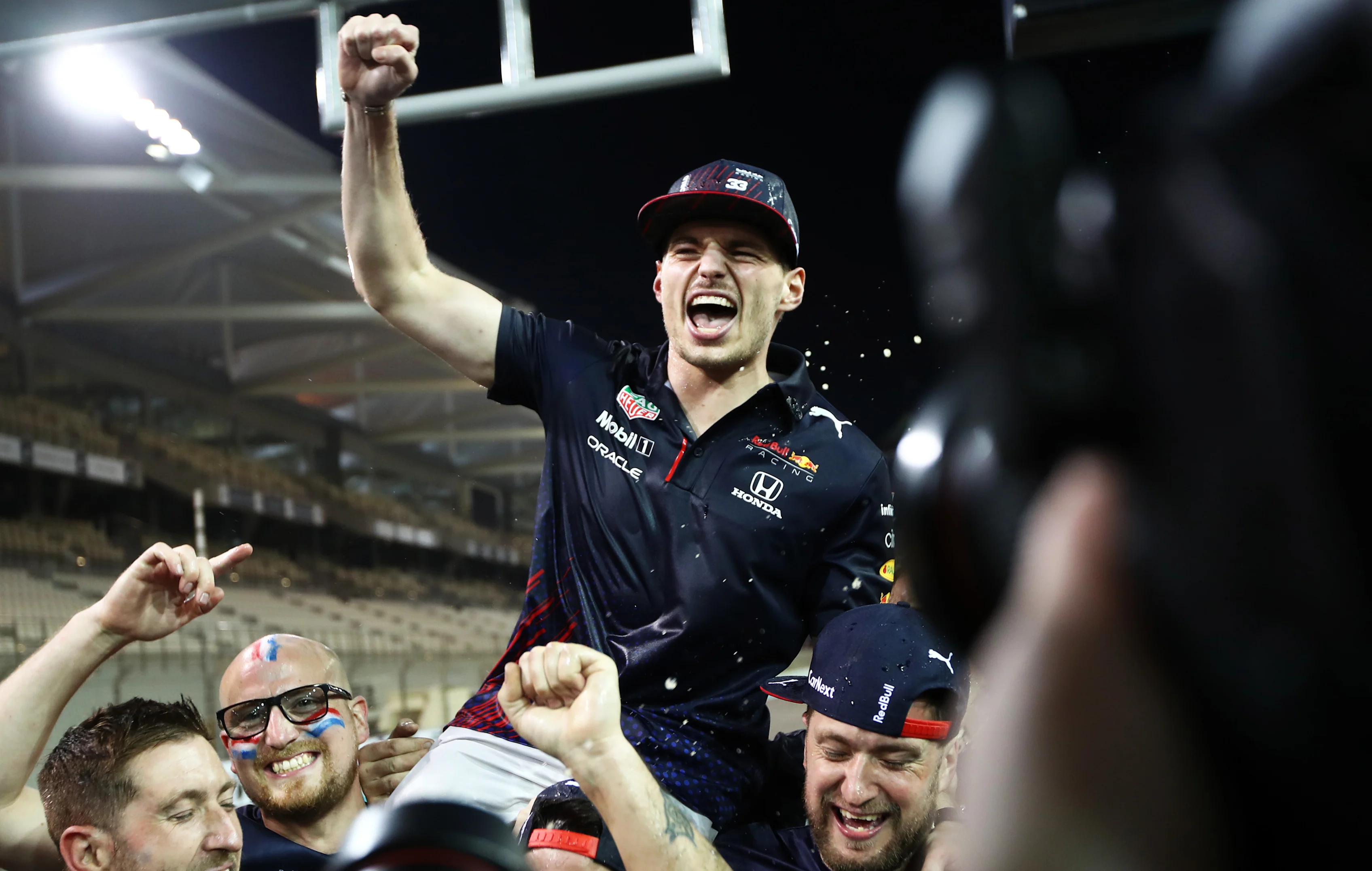 ABU DHABI, UNITED ARAB EMIRATES - DECEMBER 12: Race winner and 2021 F1 World Drivers Champion Max