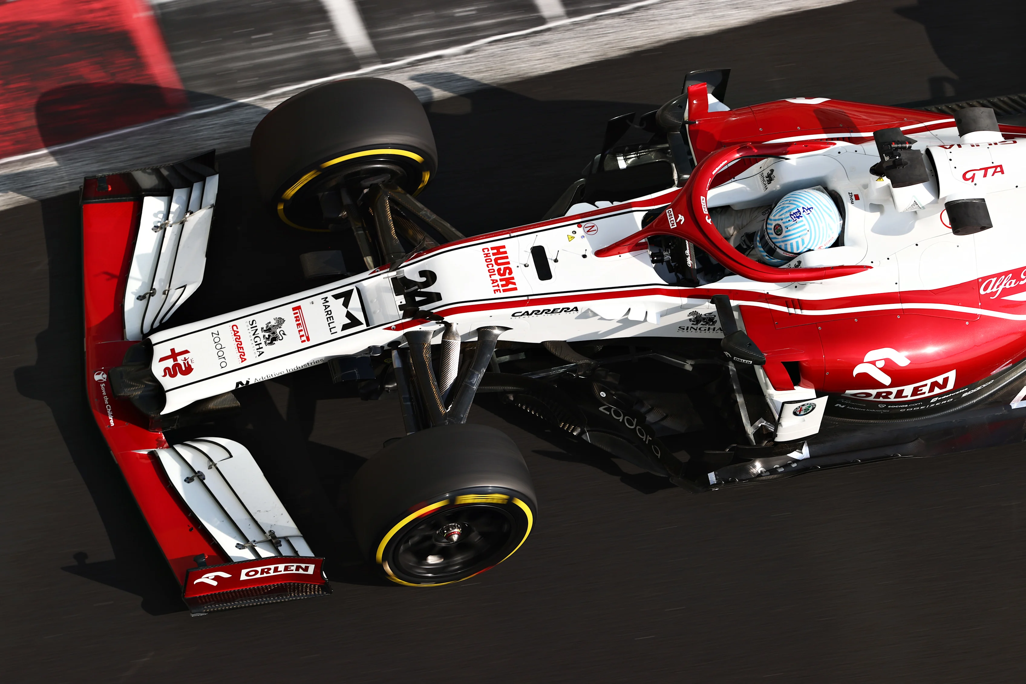 ABU DHABI, UNITED ARAB EMIRATES - DECEMBER 15: Guanyu Zhou of China driving the (24) Alfa Romeo
