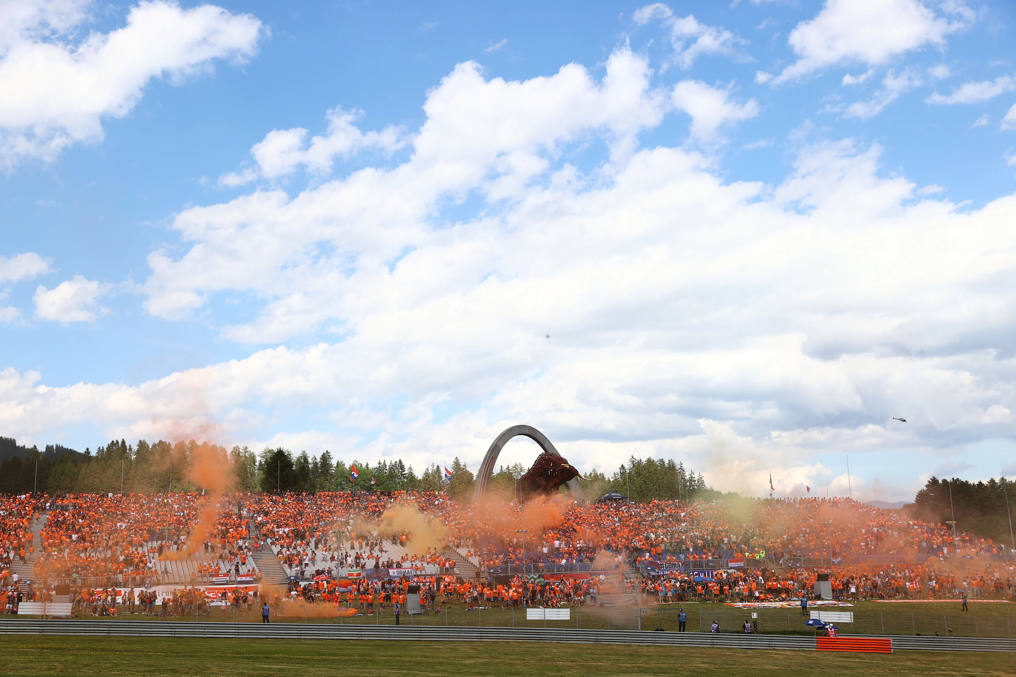 SPIELBERG, AUSTRIA - JULY 03: Max Verstappen of Netherlands and Red Bull Racing fans show their
