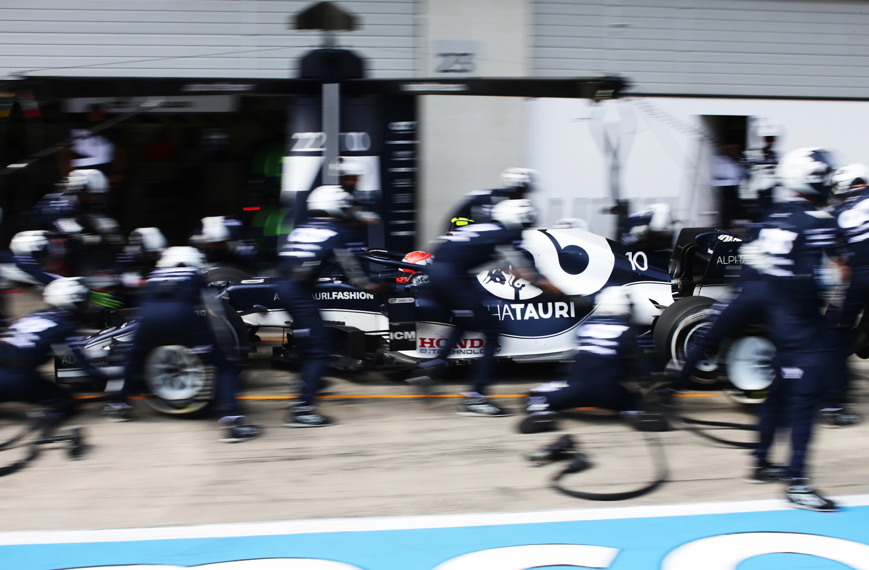 SPIELBERG, AUSTRIA - JULY 04: Pierre Gasly of France driving the (10) Scuderia AlphaTauri AT02 Honda makes a pitstop during the F1 Grand Prix of Austria at Red Bull Ring on July 04, 2021 in Spielberg, Austria. (Photo by Peter Fox/Getty Images)