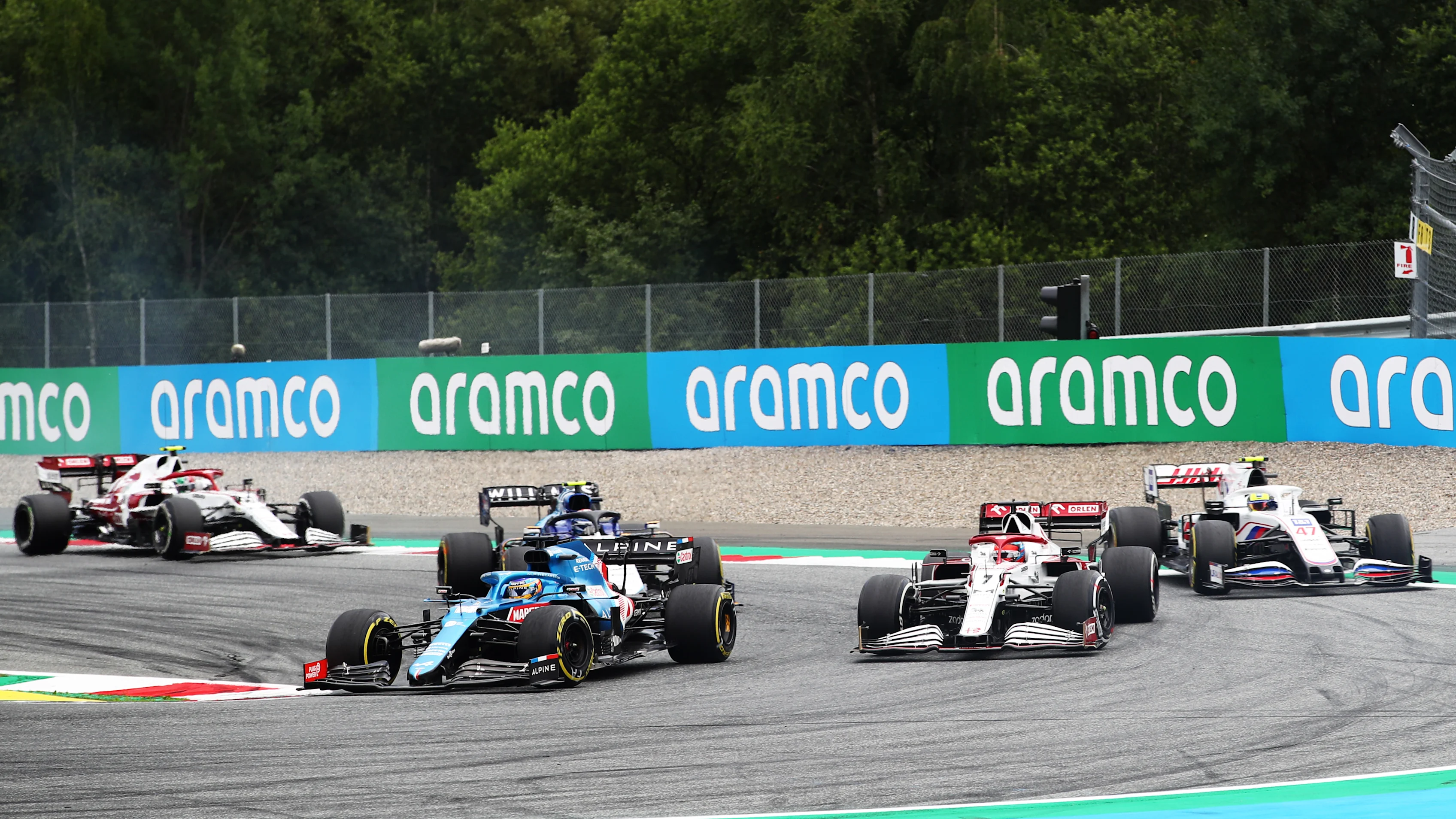 SPIELBERG, AUSTRIA - JULY 04: Fernando Alonso of Spain driving the (14) Alpine A521 Renault leads Kimi Raikkonen of Finland driving the (7) Alfa Romeo Racing C41 Ferrari during the F1 Grand Prix of Austria at Red Bull Ring on July 04, 2021 in Spielberg, Austria. (Photo by Joe Portlock - Formula 1/Formula 1 via Getty Images)