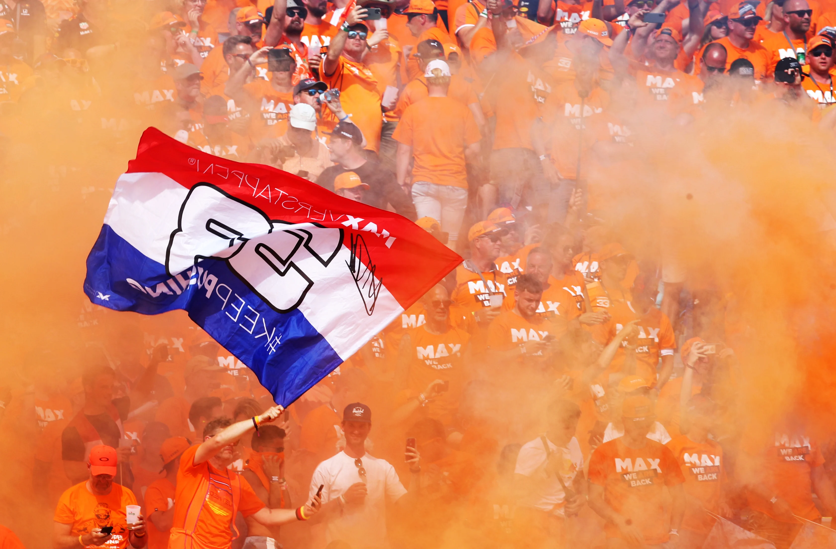 SPIELBERG, AUSTRIA - JULY 04: Max Verstappen of Netherlands and Red Bull Racing fans show their