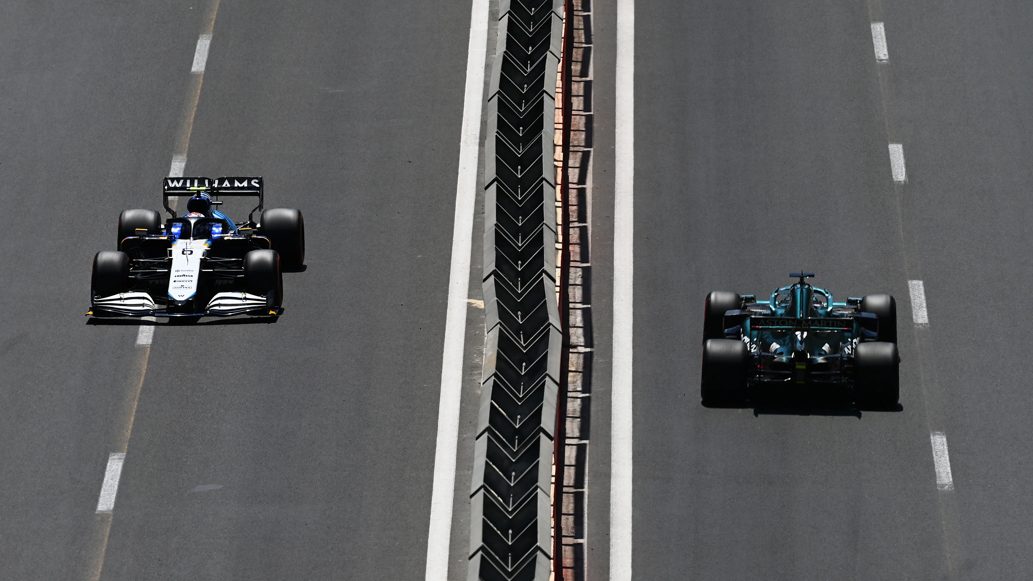 BAKU, AZERBAIJAN - JUNE 05: Nicholas Latifi of Canada driving the (6) Williams Racing FW43B Mercedes and Lance Stroll of Canada driving the (18) Aston Martin AMR21 Mercedes on track during final practice ahead of the F1 Grand Prix of Azerbaijan at Baku City Circuit on June 05, 2021 in Baku, Azerbaijan. (Photo by Dan Mullan - Formula 1/Formula 1 via Getty Images)