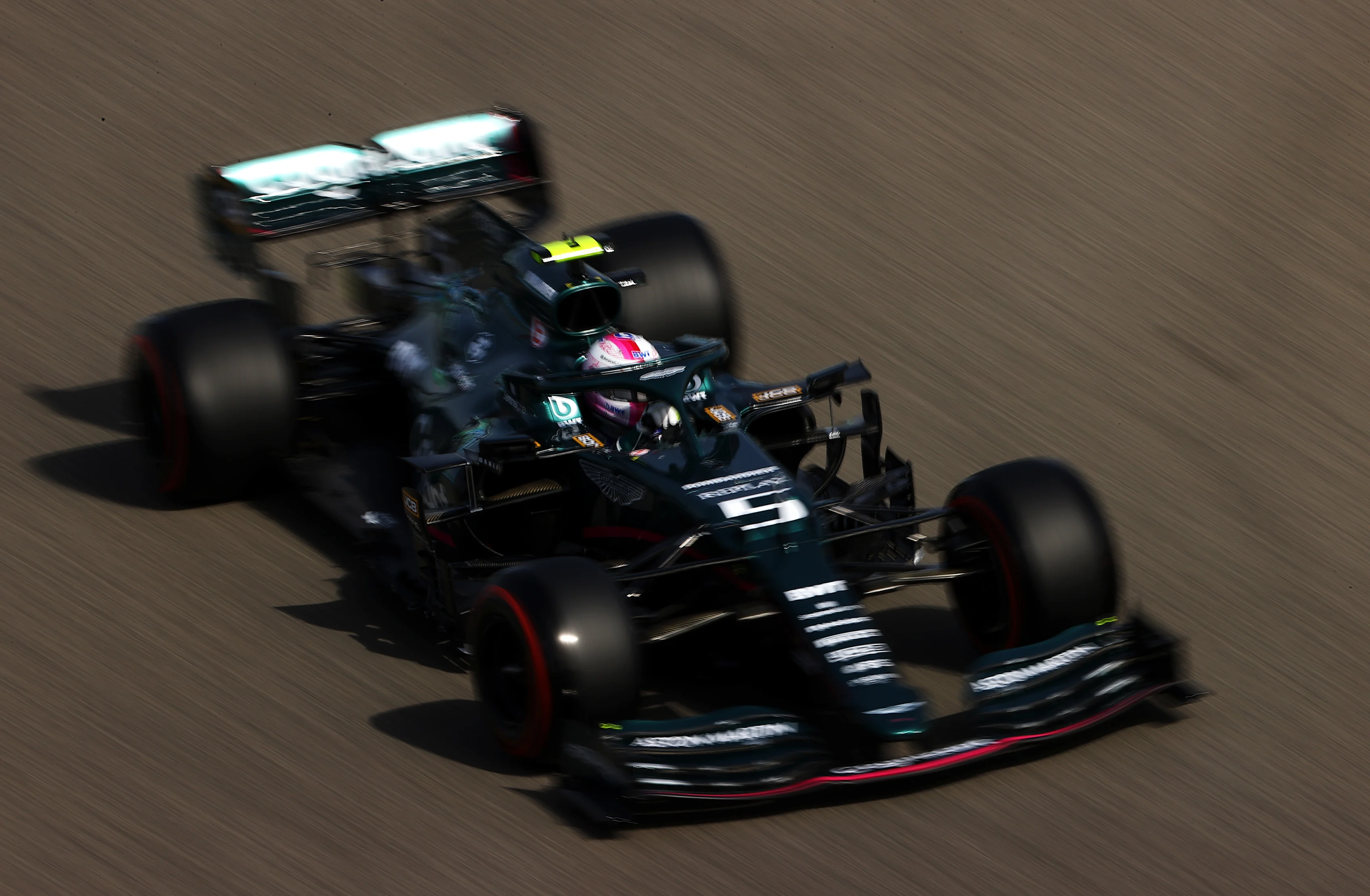 BAHRAIN, BAHRAIN - MARCH 26: Sebastian Vettel of Germany driving the (5) Aston Martin AMR21 Mercedes drives on track during practice ahead of the F1 Grand Prix of Bahrain at Bahrain International Circuit on March 26, 2021 in Bahrain, Bahrain. (Photo by Bryn Lennon/Getty Images)