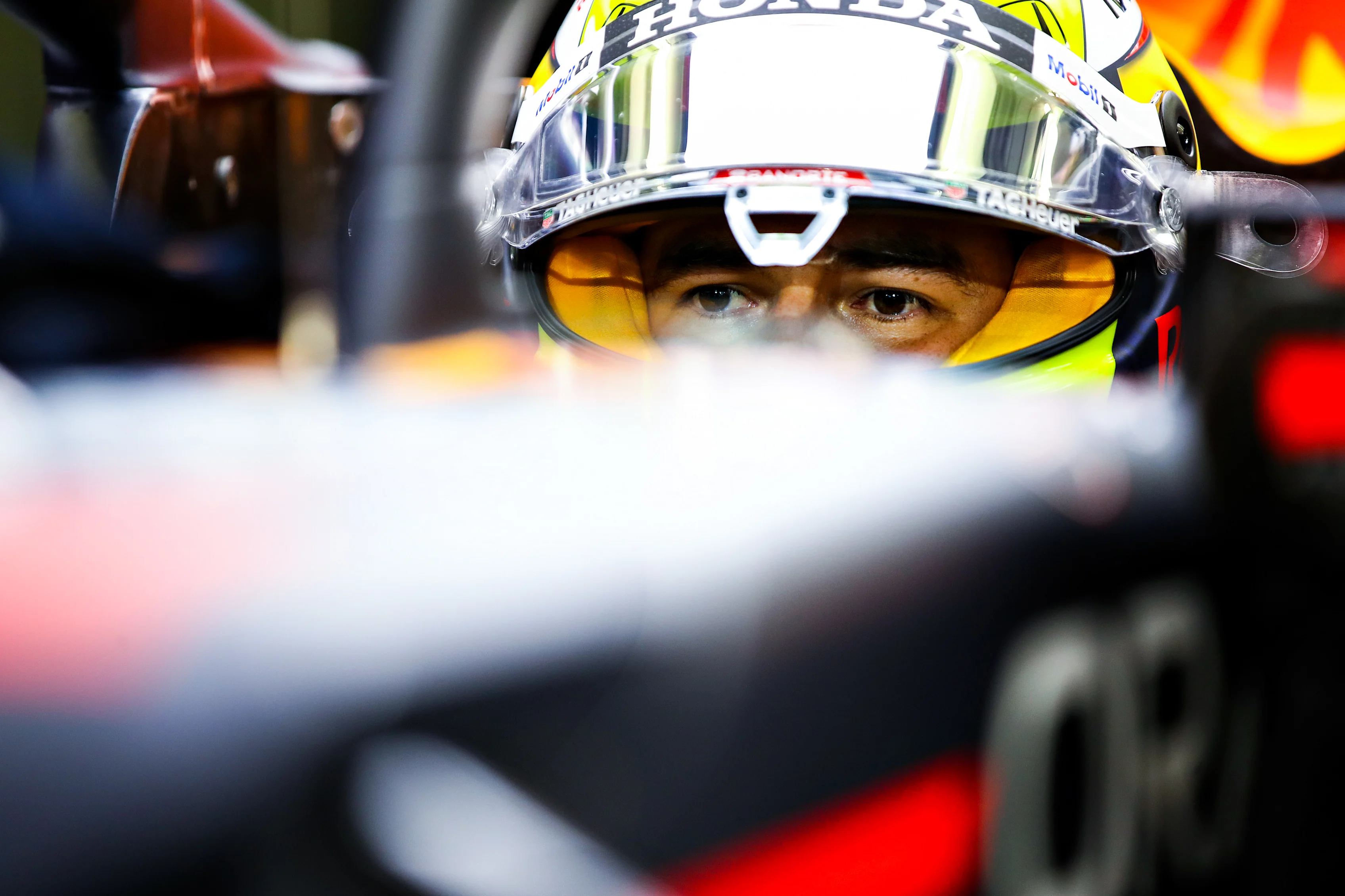 BAHRAIN, BAHRAIN - MARCH 27: Sergio Perez of Mexico and Red Bull Racing prepares to drive in the garage during qualifying ahead of the F1 Grand Prix of Bahrain at Bahrain International Circuit on March 27, 2021 in Bahrain, Bahrain. (Photo by Mark Thompson/Getty Images)