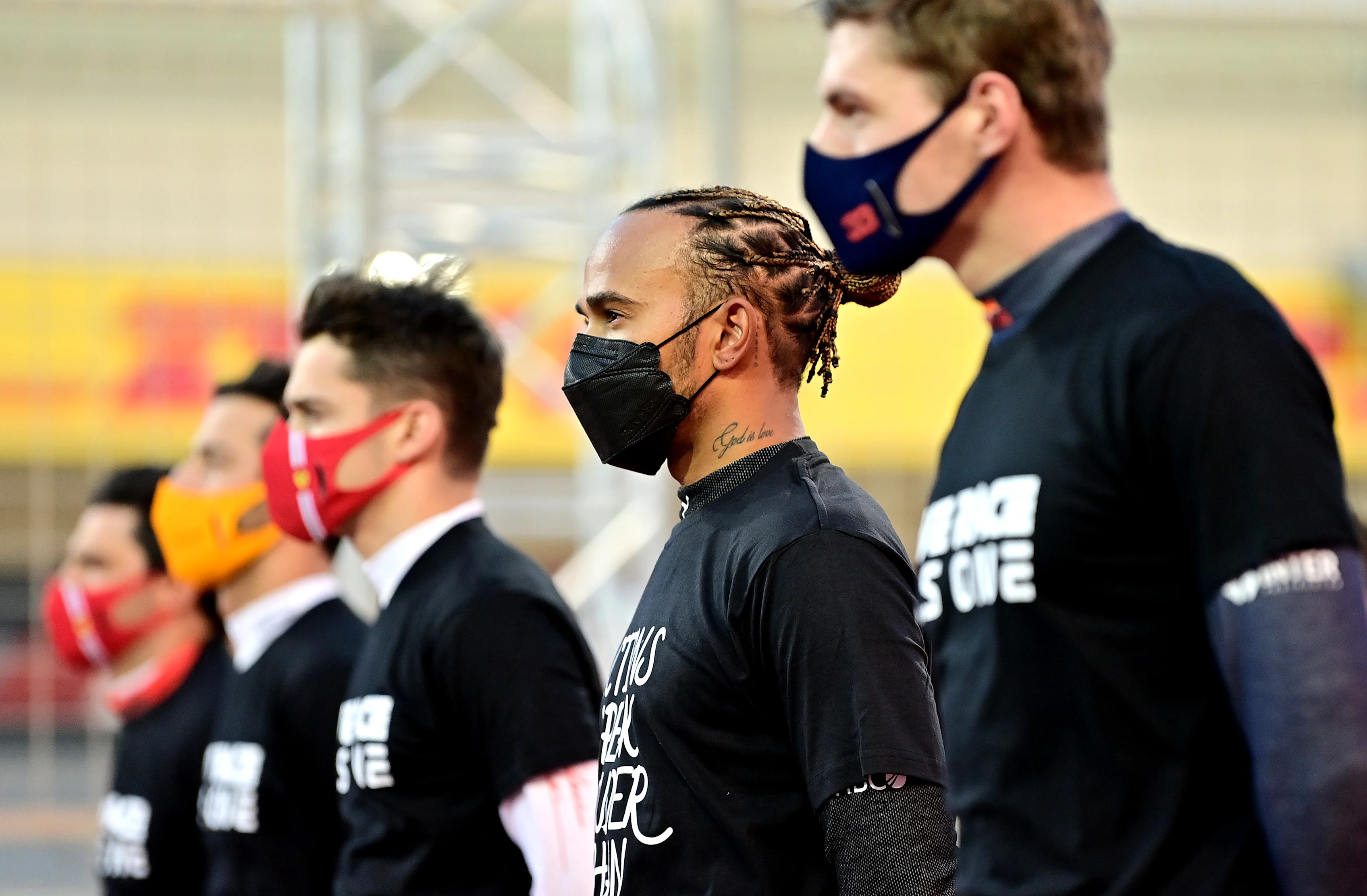 BAHRAIN, BAHRAIN - MARCH 28: Lewis Hamilton of Great Britain and Mercedes GP looks on as he stands