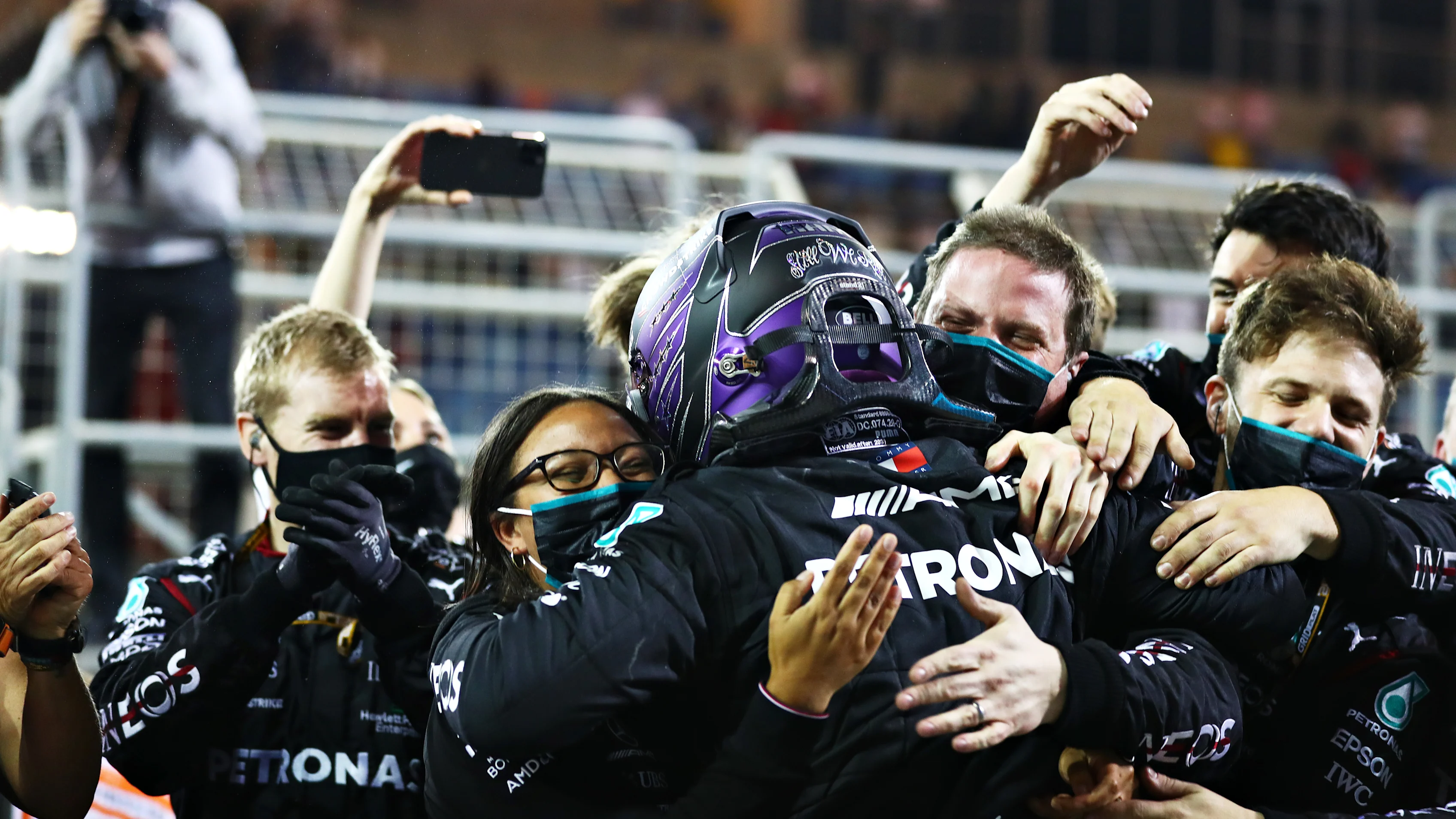BAHRAIN, BAHRAIN - MARCH 28: Race winner Lewis Hamilton of Great Britain and Mercedes GP celebrates