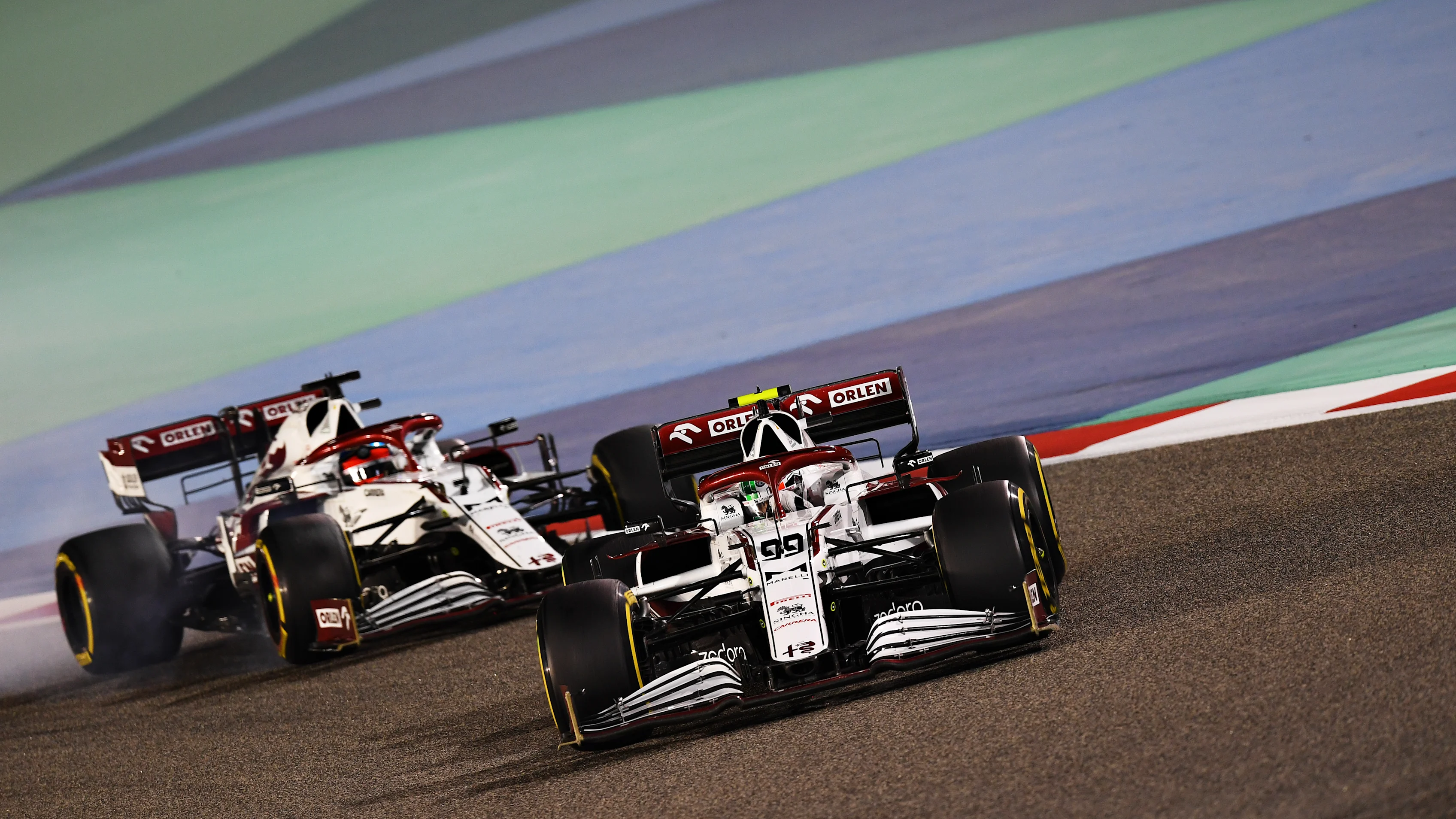 BAHRAIN, BAHRAIN - MARCH 28: Antonio Giovinazzi of Italy driving the (99) Alfa Romeo Racing C41 Ferrari leads Kimi Raikkonen of Finland driving the (7) Alfa Romeo Racing C41 Ferrari on track during the F1 Grand Prix of Bahrain at Bahrain International Circuit on March 28, 2021 in Bahrain, Bahrain. (Photo by Clive Mason - Formula 1/Formula 1 via Getty Images)