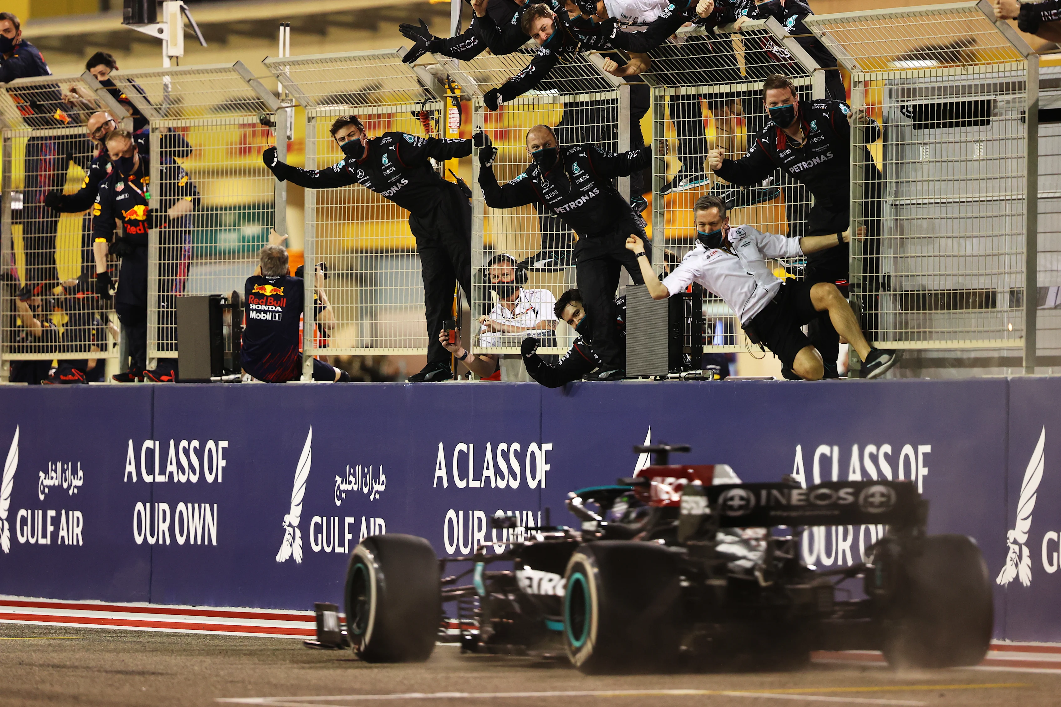BAHRAIN, BAHRAIN - MARCH 28: Mercedes GP team members celebrate on the pitwall as Lewis Hamilton of