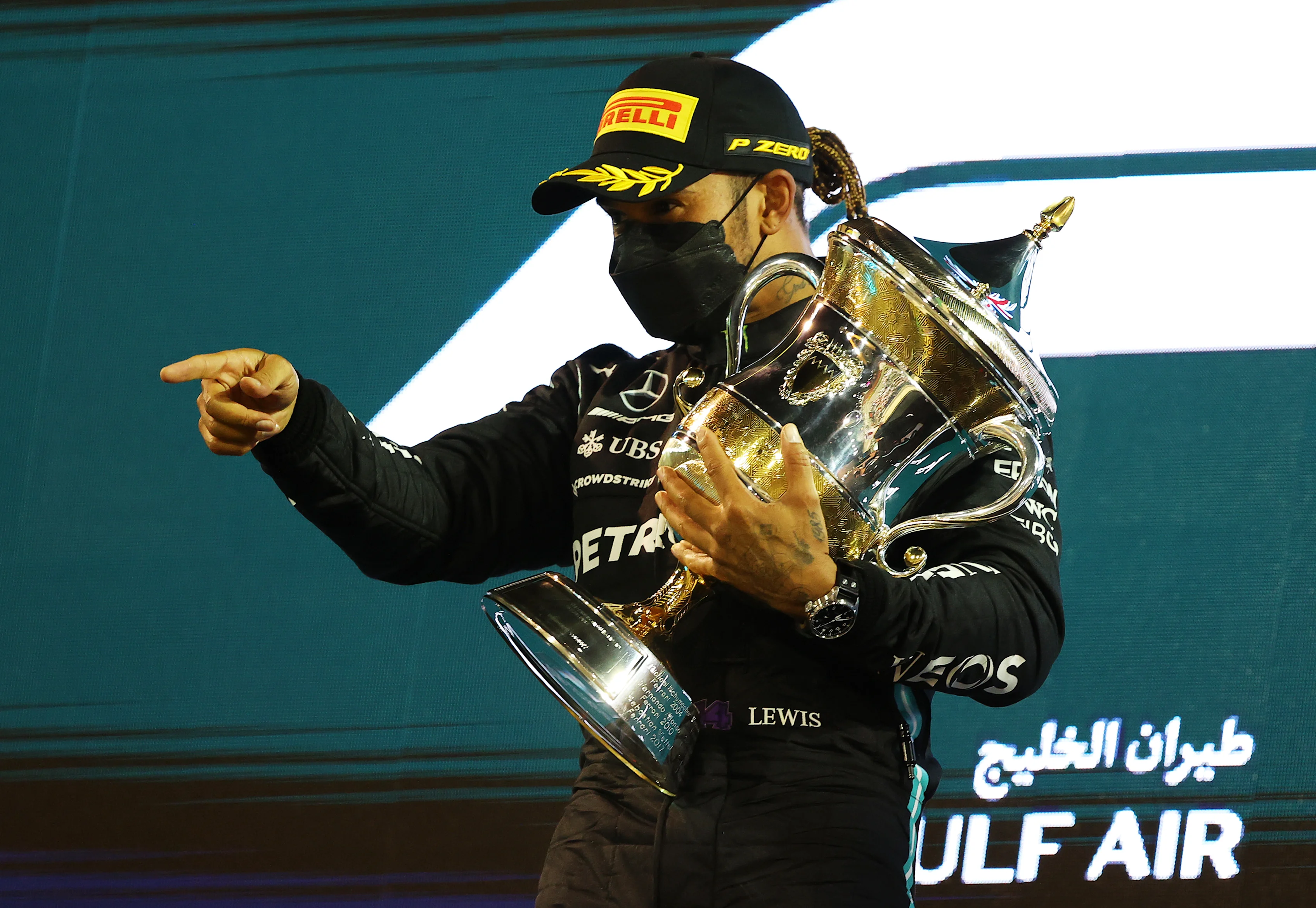 BAHRAIN, BAHRAIN - MARCH 28: Race winner Lewis Hamilton of Great Britain and Mercedes GP celebrates