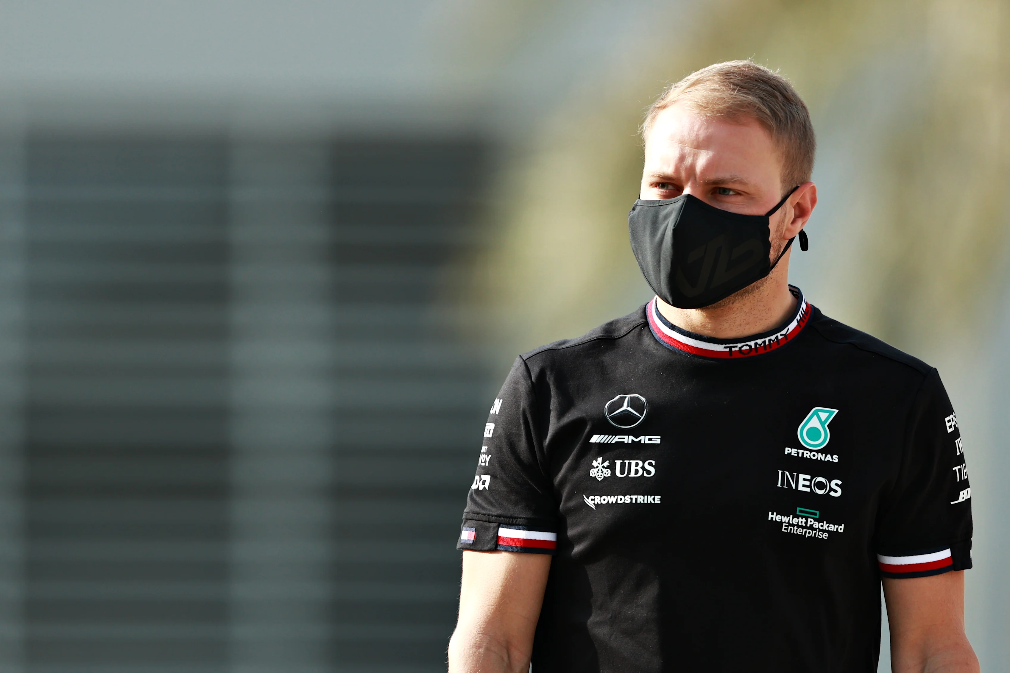 BAHRAIN, BAHRAIN - MARCH 12: Valtteri Bottas of Finland and Mercedes GP walks in the Paddock during