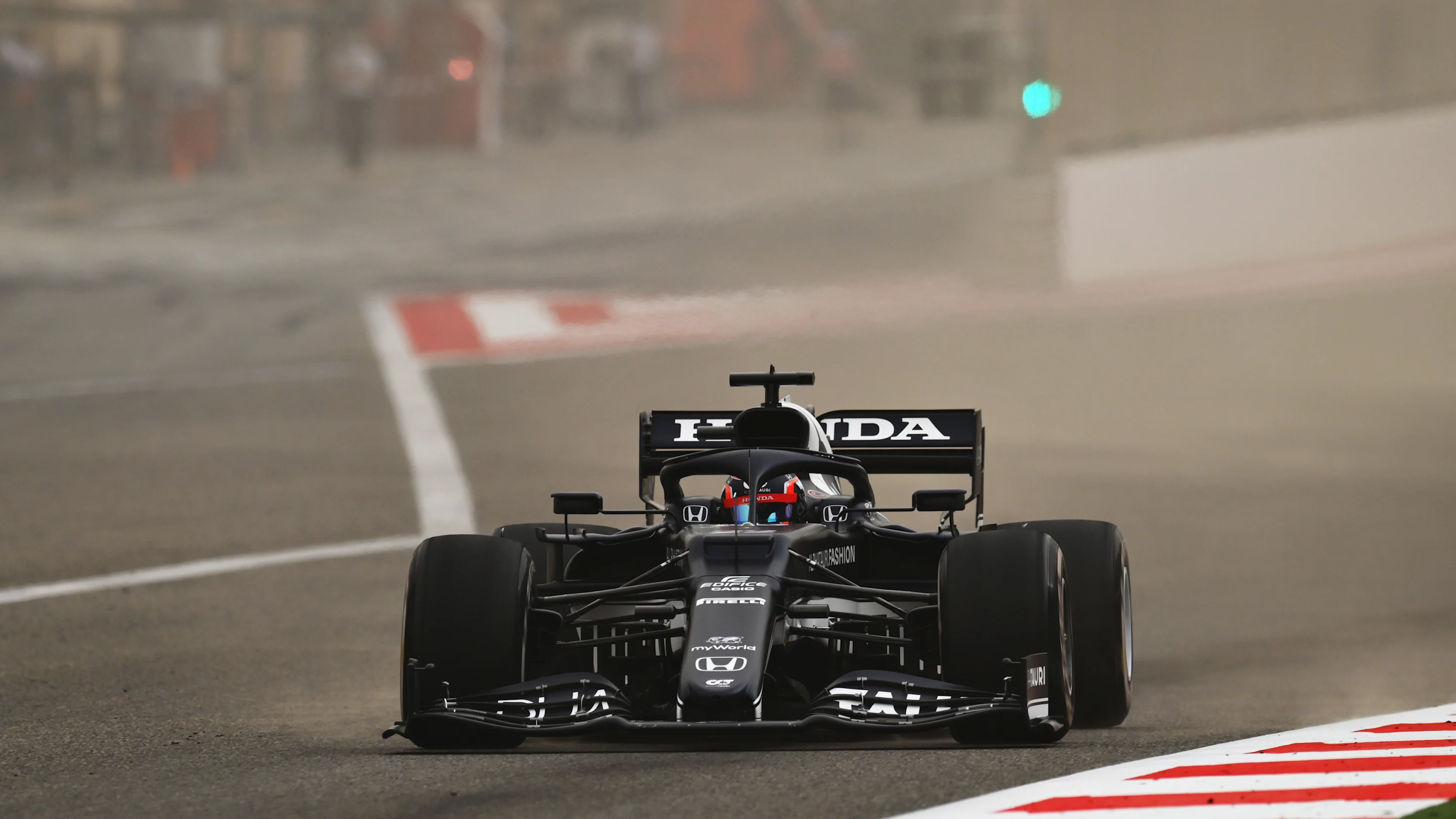 BAHRAIN, BAHRAIN - MARCH 12: Yuki Tsunoda of Japan driving the (22) Scuderia AlphaTauri AT02 Honda