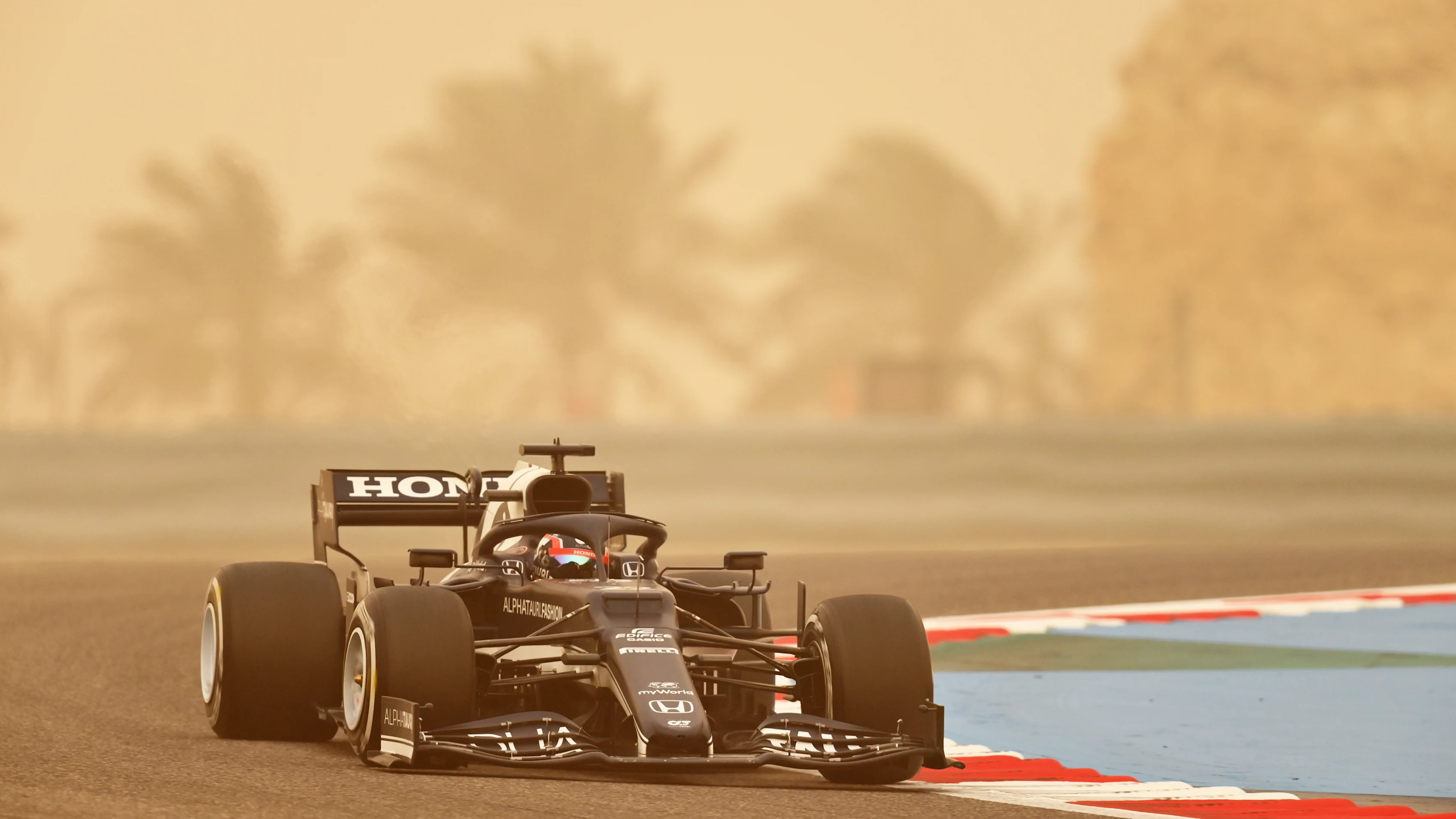 BAHRAIN, BAHRAIN - MARCH 12: Yuki Tsunoda of Japan driving the (22) Scuderia AlphaTauri AT02 Honda