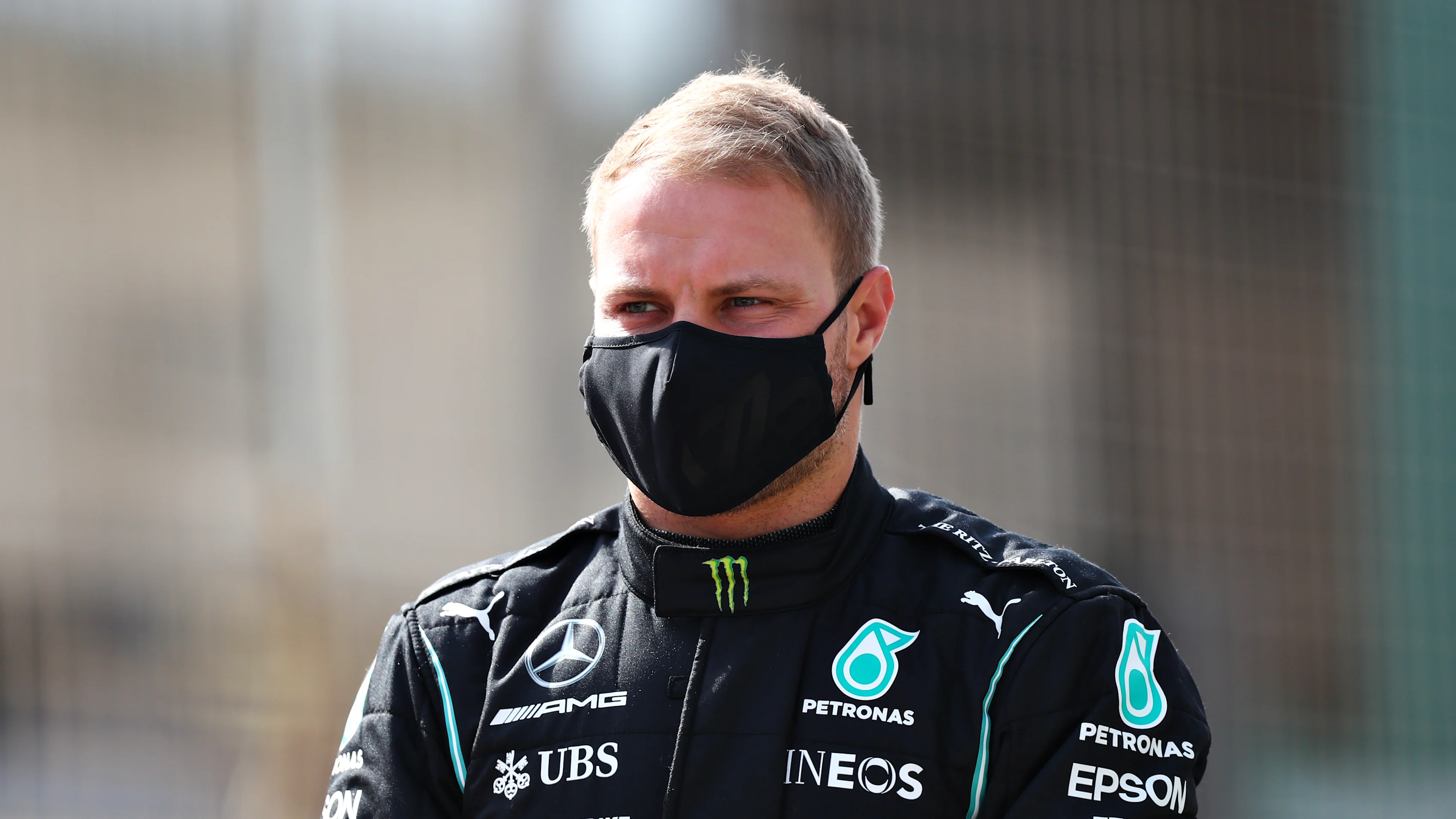 BAHRAIN, BAHRAIN - MARCH 12: Valtteri Bottas of Finland and Mercedes GP looks on from the grid