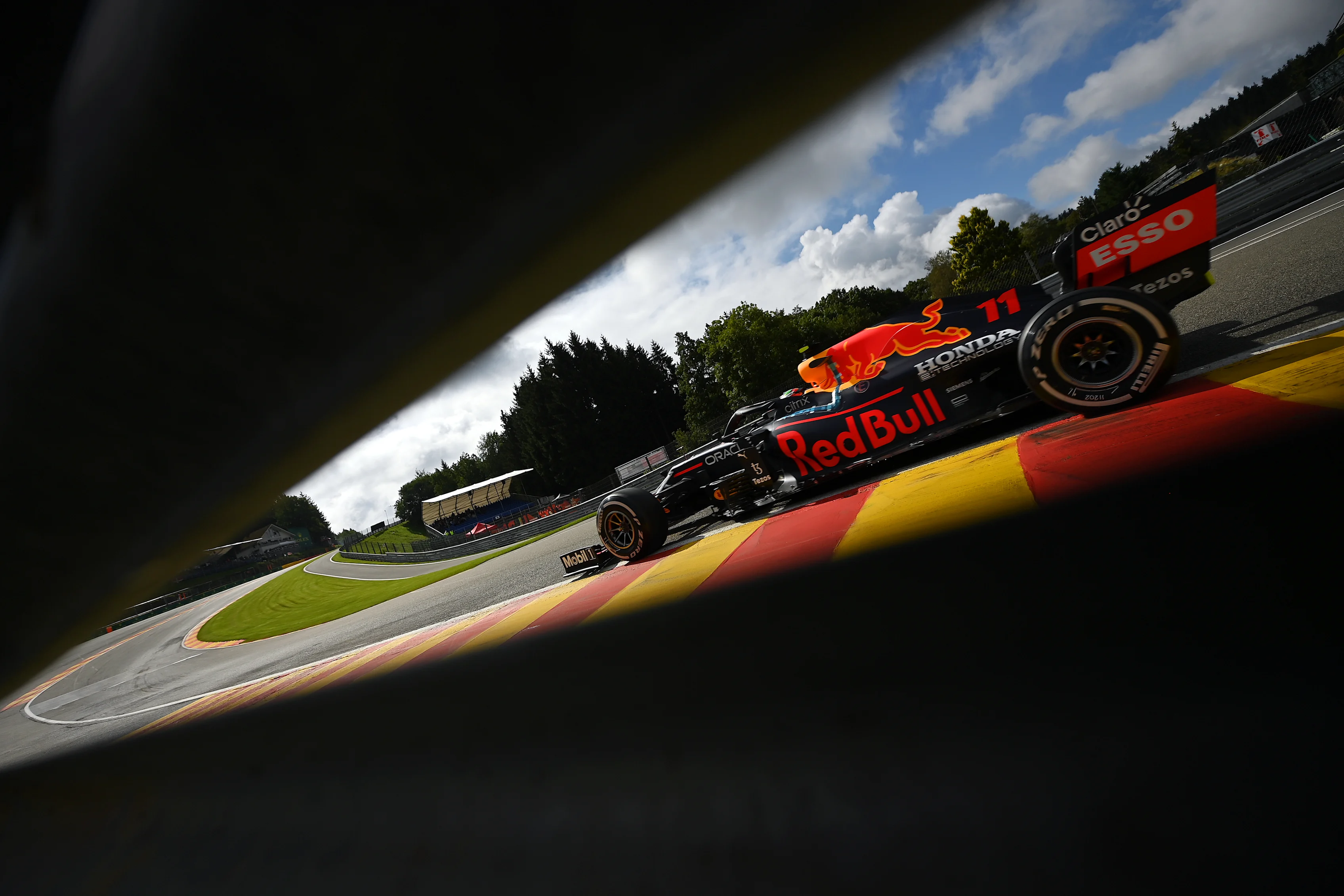 SPA, BELGIUM - AUGUST 27: Sergio Perez of Mexico driving the (11) Red Bull Racing RB16B Honda during practice ahead of the F1 Grand Prix of Belgium at Circuit de Spa-Francorchamps on August 27, 2021 in Spa, Belgium. (Photo by Dan Mullan/Getty Images)