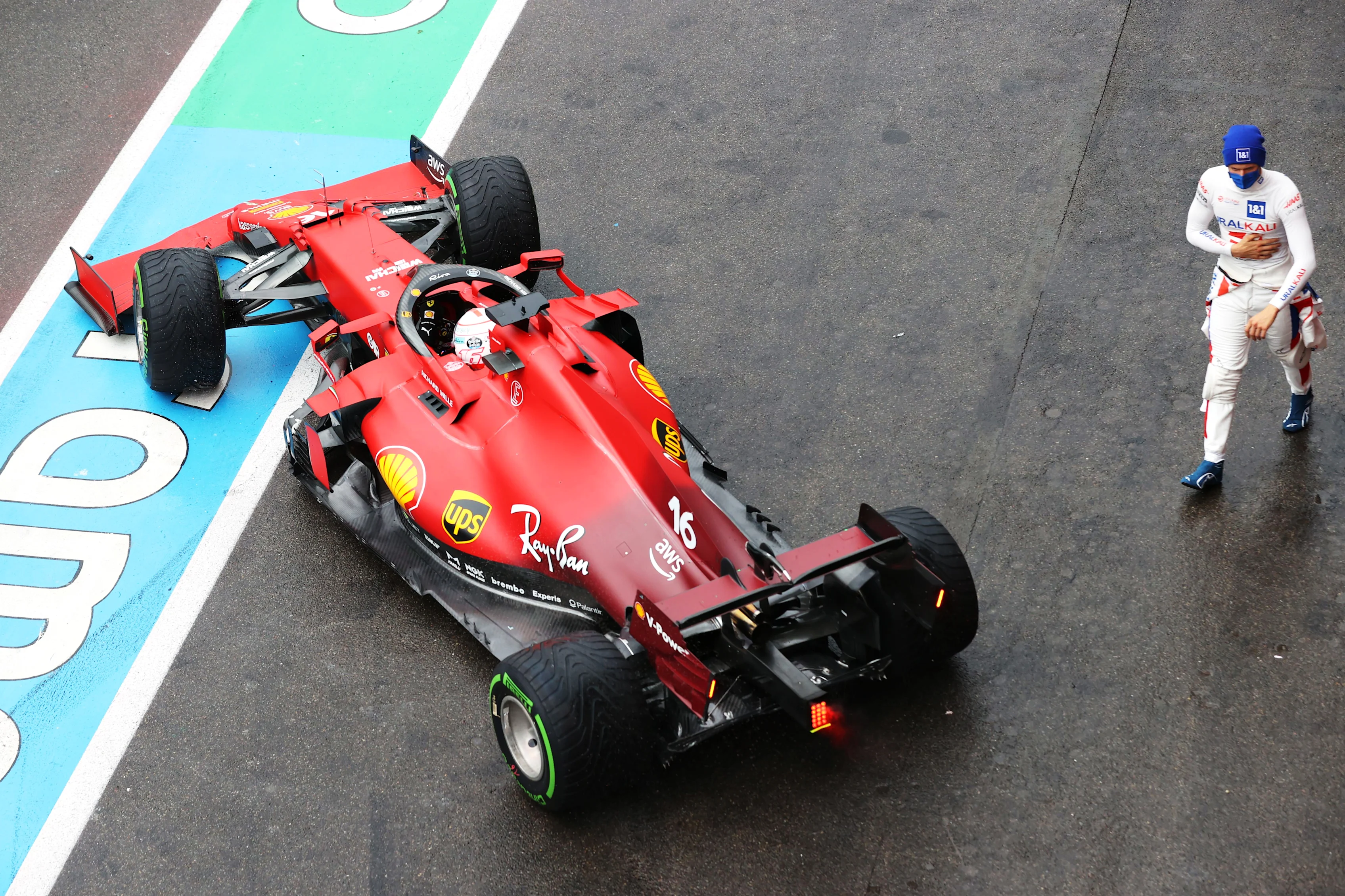 SPA, BELGIUM - AUGUST 28: Mick Schumacher of Germany and Haas F1 walks past Charles Leclerc of