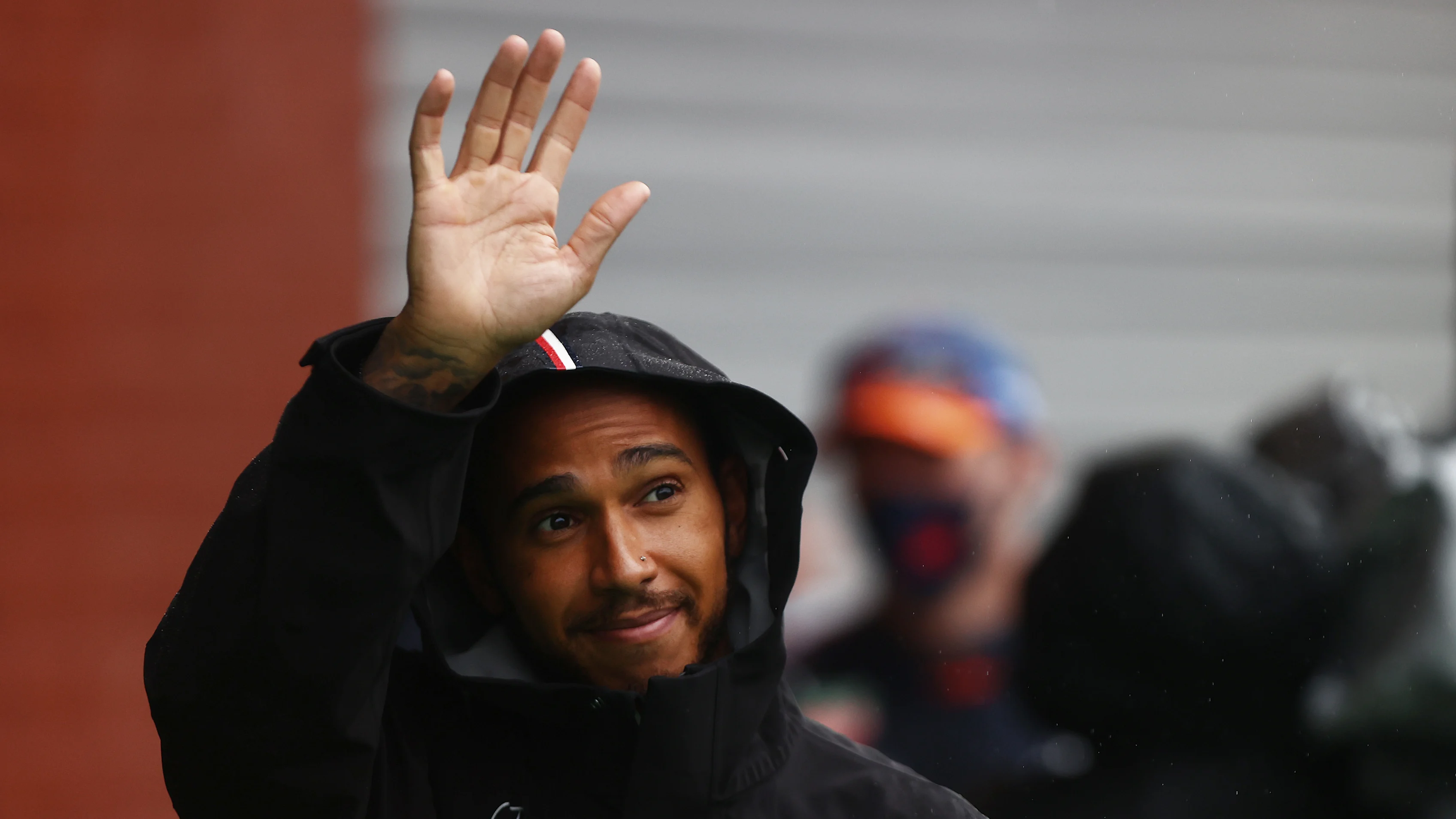 SPA, BELGIUM - AUGUST 29: Lewis Hamilton of Great Britain and Mercedes GP waves from the pitlane