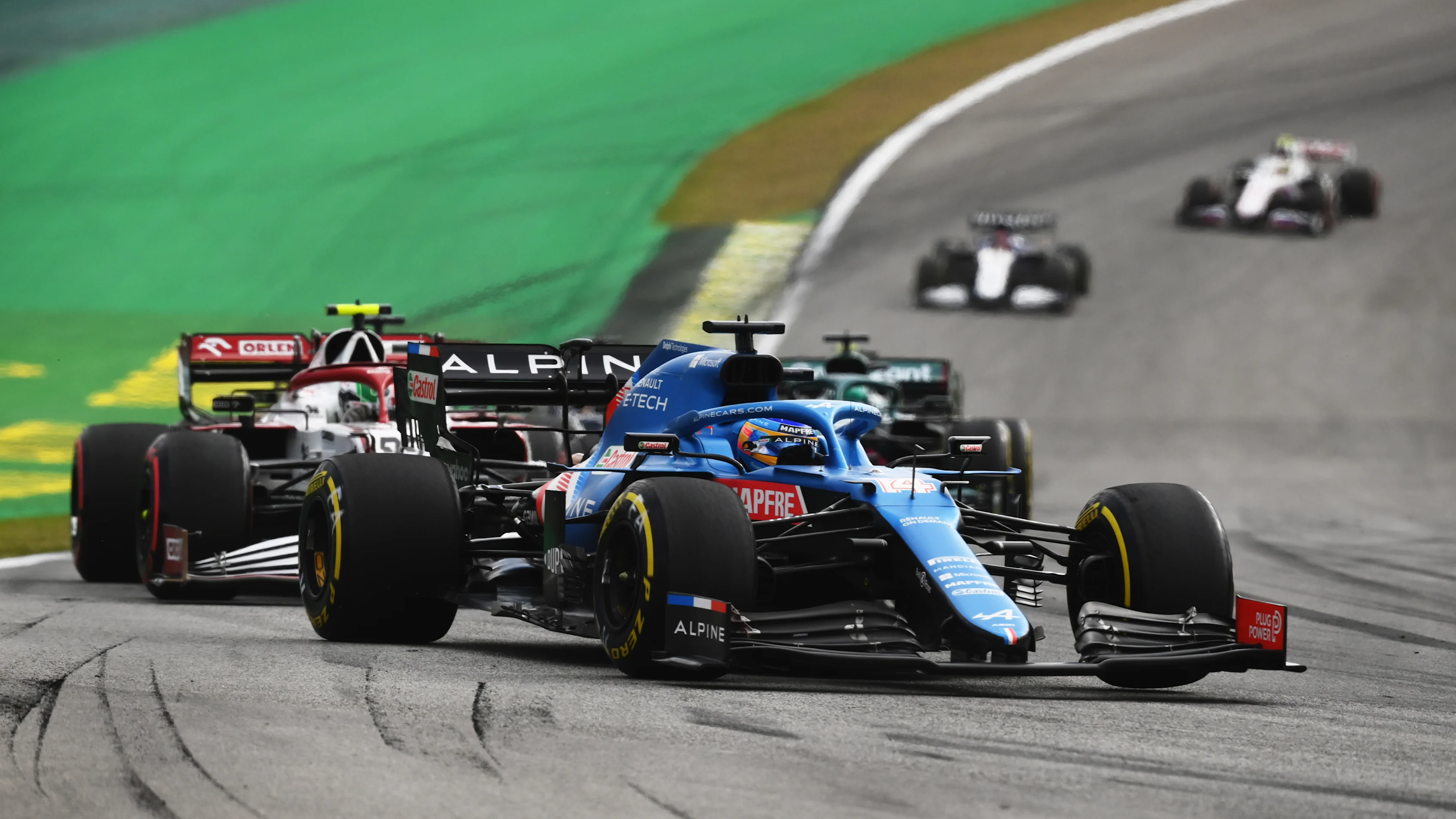 SAO PAULO, BRAZIL - NOVEMBER 13: Fernando Alonso of Spain driving the (14) Alpine A521 Renault leads Antonio Giovinazzi of Italy driving the (99) Alfa Romeo Racing C41 Ferrari during the sprint ahead of the F1 Grand Prix of Brazil at Autodromo Jose Carlos Pace on November 13, 2021 in Sao Paulo, Brazil. (Photo by Clive Mason - Formula 1/Formula 1 via Getty Images)