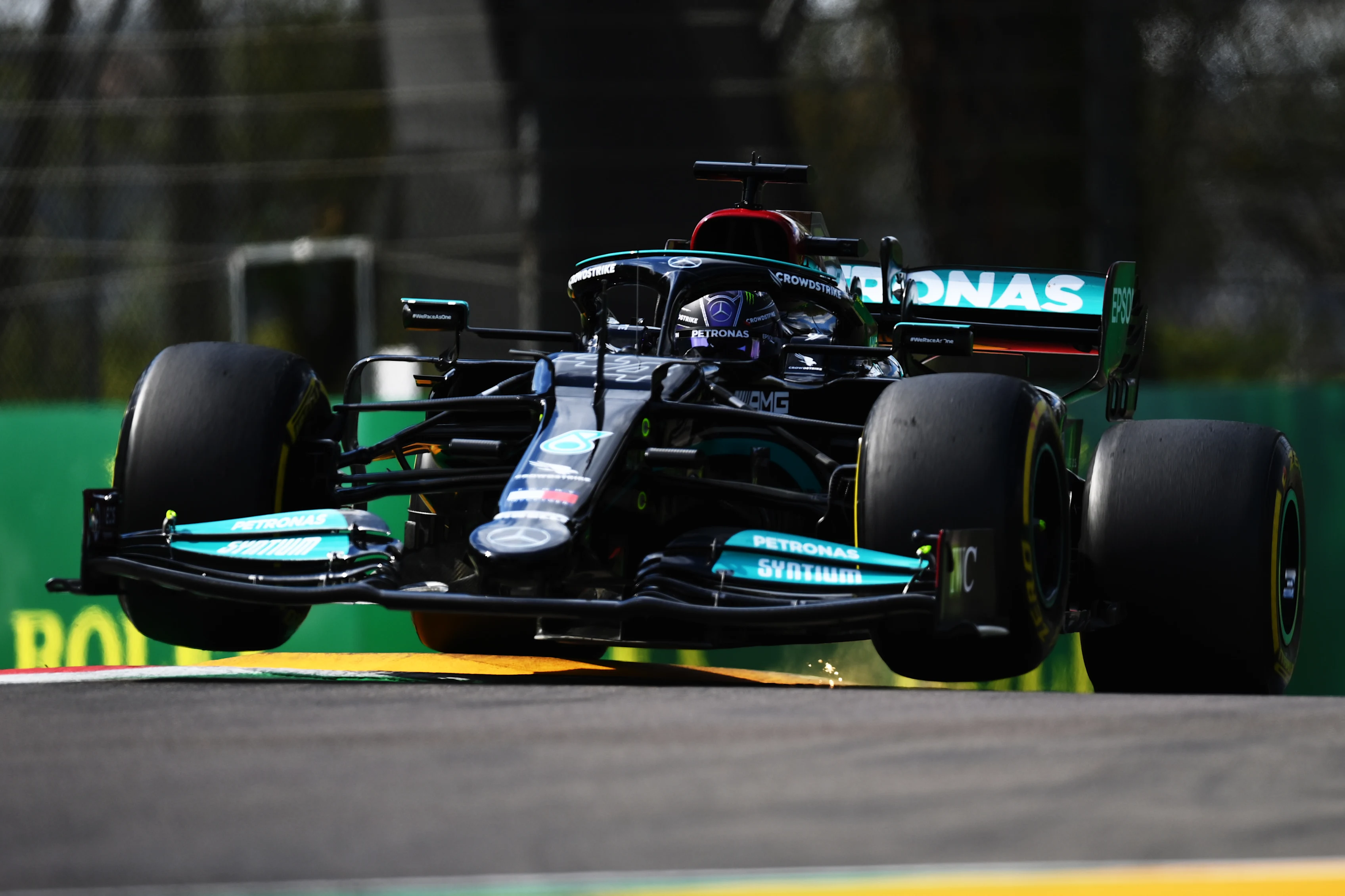 IMOLA, ITALY - APRIL 16: Lewis Hamilton of Great Britain driving the (44) Mercedes AMG Petronas F1 Team Mercedes W12 launches off a raised kerb during practice ahead of the F1 Grand Prix of Emilia Romagna at Autodromo Enzo e Dino Ferrari on April 16, 2021 in Imola, Italy. (Photo by Clive Mason - Formula 1/Formula 1 via Getty Images)