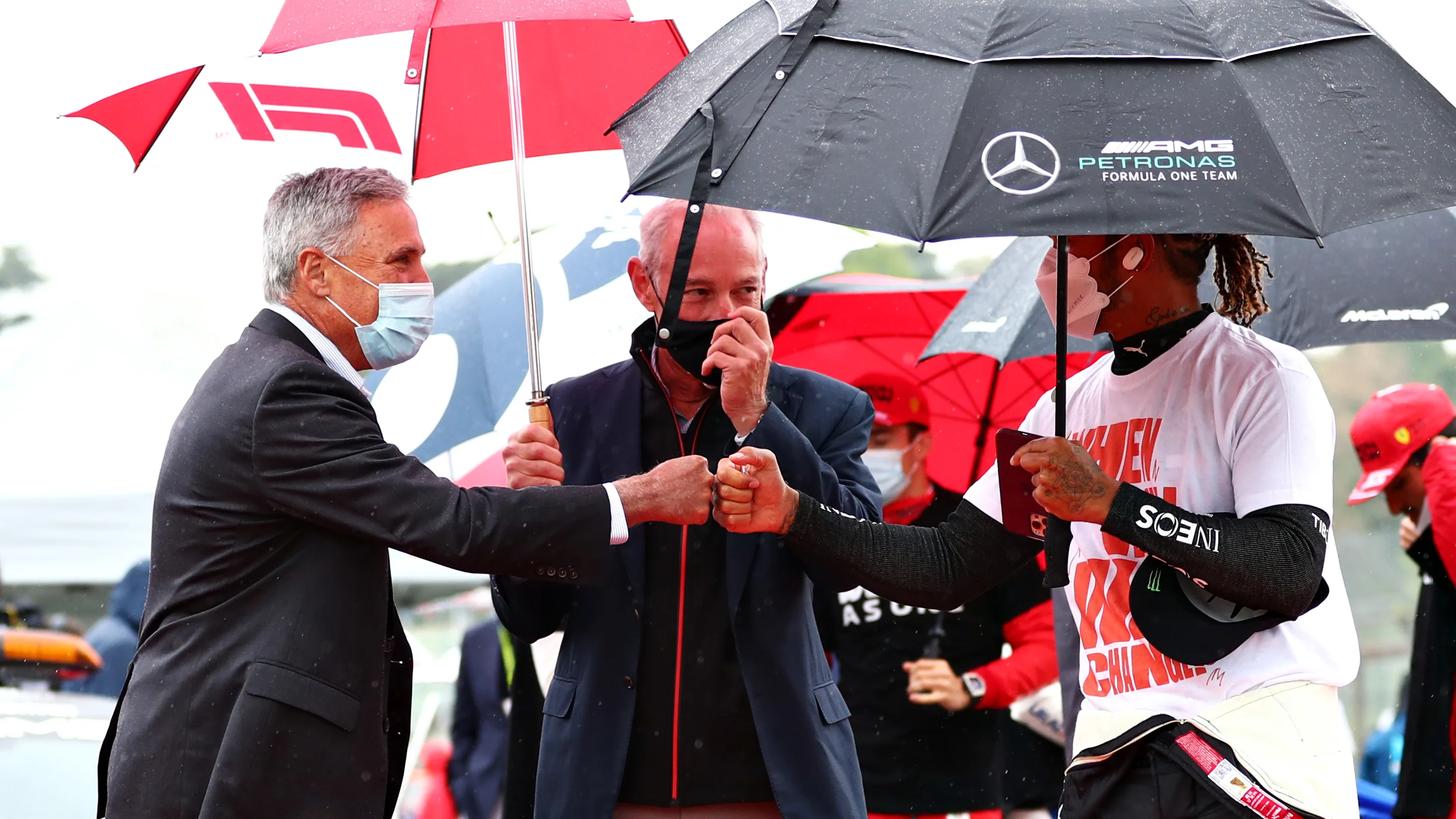 IMOLA, ITALY - APRIL 18: Lewis Hamilton of Great Britain and Mercedes GP talks with Chase Carey and