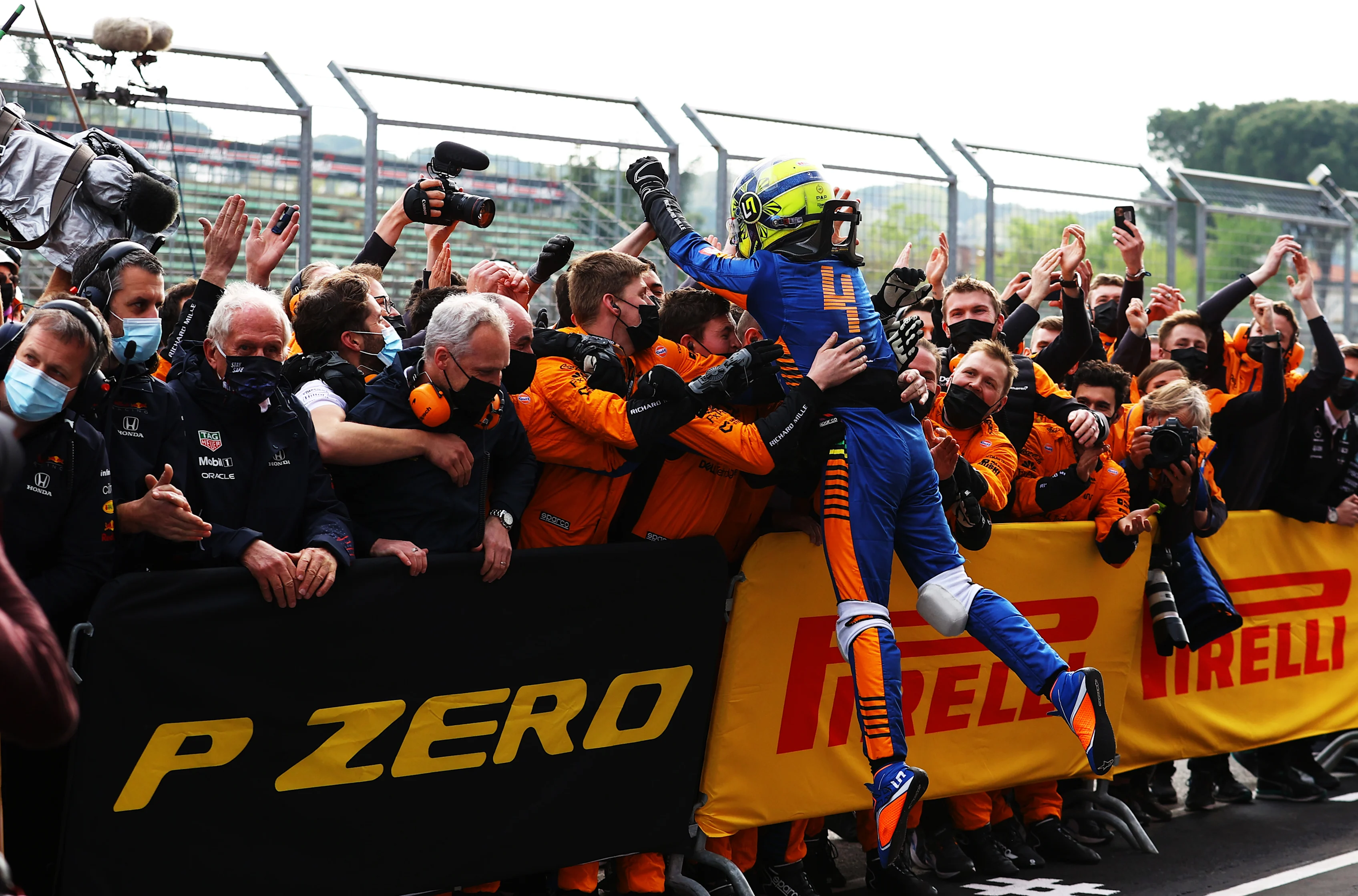 IMOLA, ITALY - APRIL 18: Third placed Lando Norris of Great Britain and McLaren F1 celebrates in parc ferme with his team during the F1 Grand Prix of Emilia Romagna at Autodromo Enzo e Dino Ferrari on April 18, 2021 in Imola, Italy. (Photo by Bryn Lennon/Getty Images)