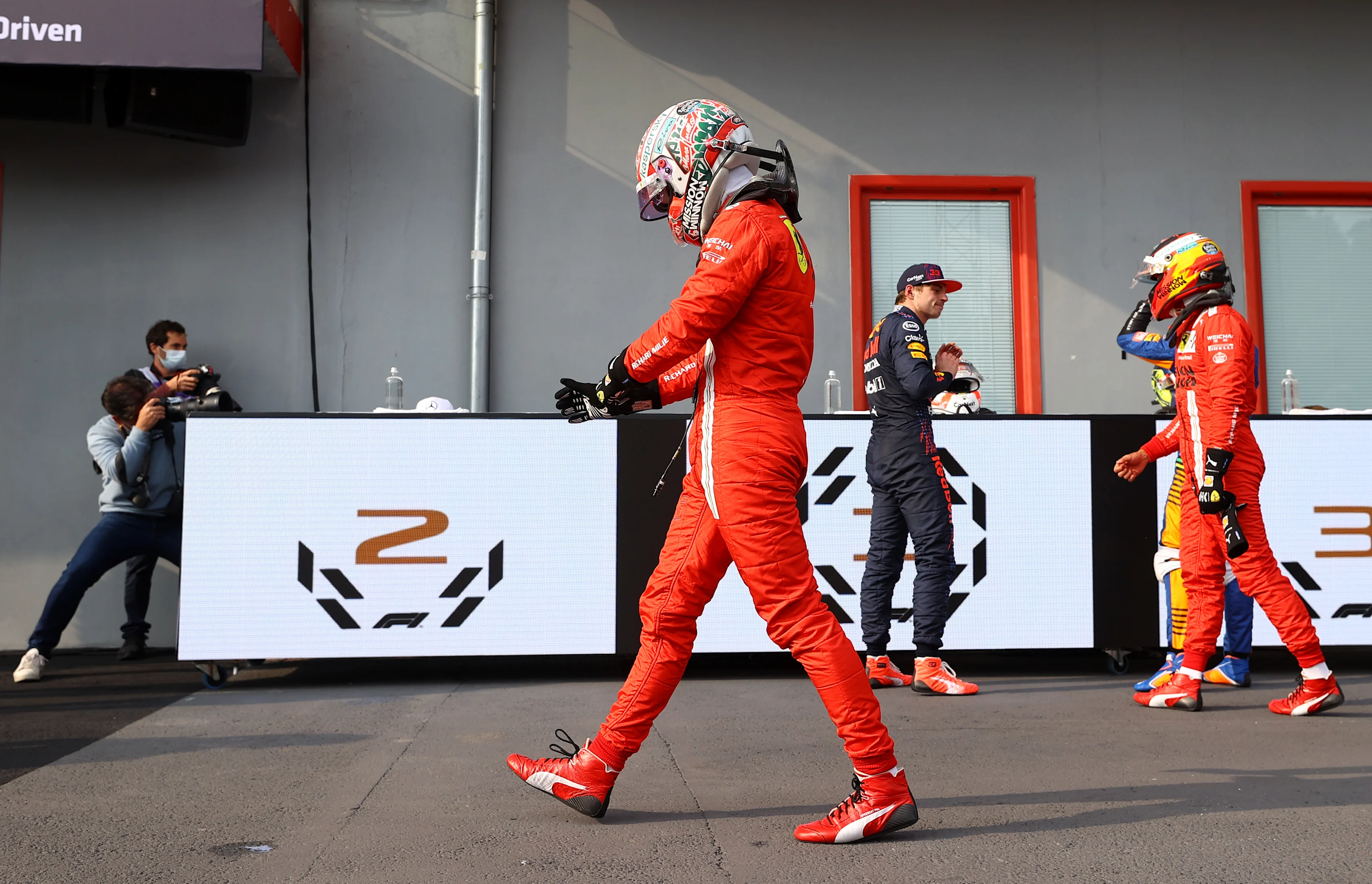 IMOLA, ITALY - APRIL 18: Fourth placed Charles Leclerc of Monaco and Ferrari walks in parc ferme after the F1 Grand Prix of Emilia Romagna at Autodromo Enzo e Dino Ferrari on April 18, 2021 in Imola, Italy. (Photo by Bryn Lennon/Getty Images)