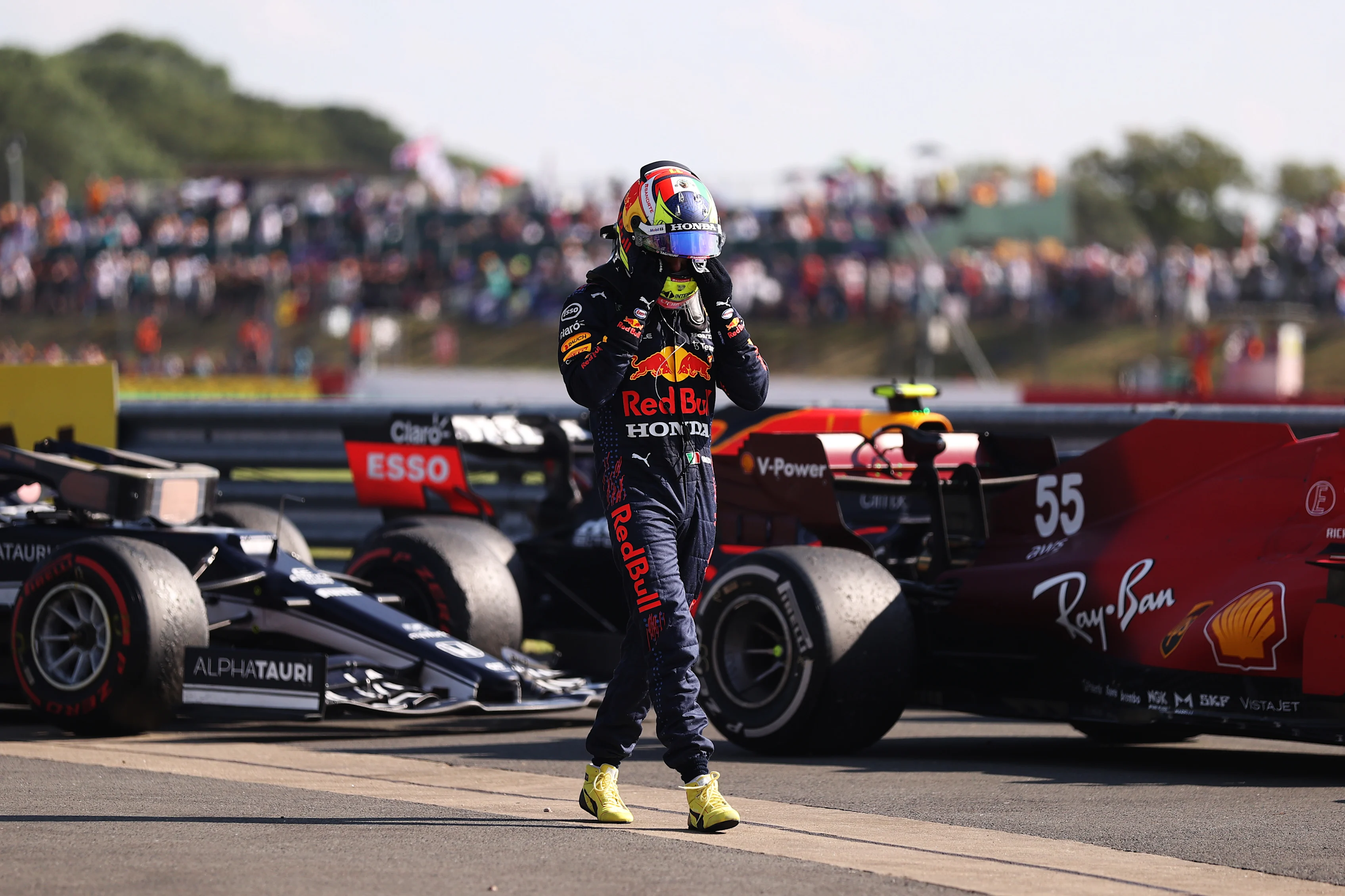 NORTHAMPTON, ENGLAND - JULY 18: Sergio Perez of Mexico and Red Bull Racing walks in parc ferme during the F1 Grand Prix of Great Britain at Silverstone on July 18, 2021 in Northampton, England. (Photo by Lars Baron/Getty Images)
