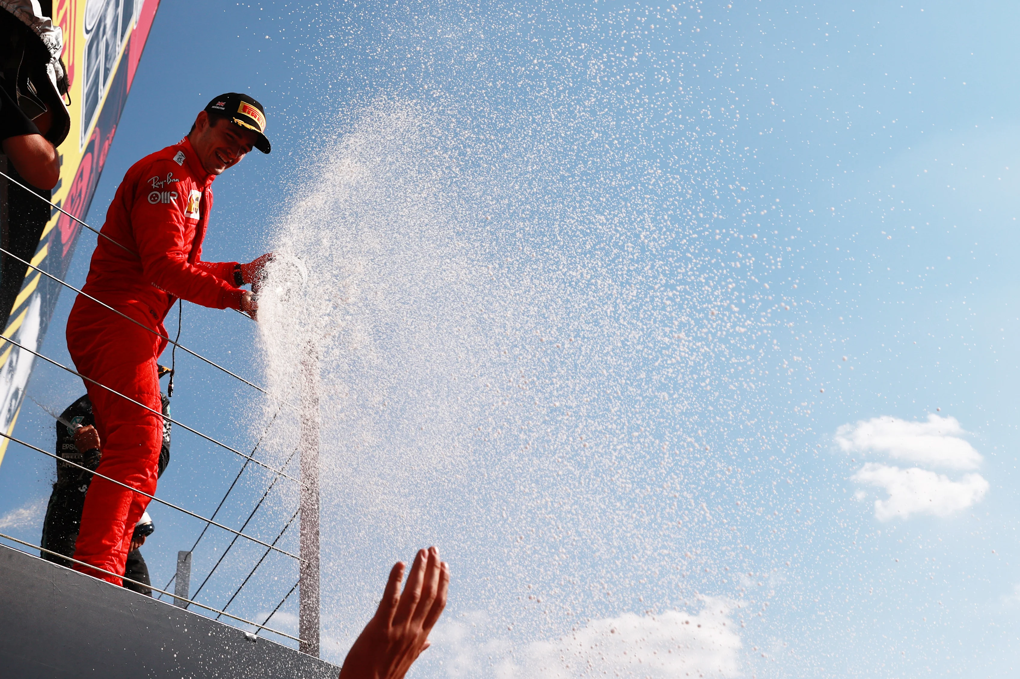 NORTHAMPTON, ENGLAND - JULY 18: Second placed Charles Leclerc of Monaco and Ferrari celebrates on the podium  during the F1 Grand Prix of Great Britain at Silverstone on July 18, 2021 in Northampton, England. (Photo by Mark Thompson/Getty Images)