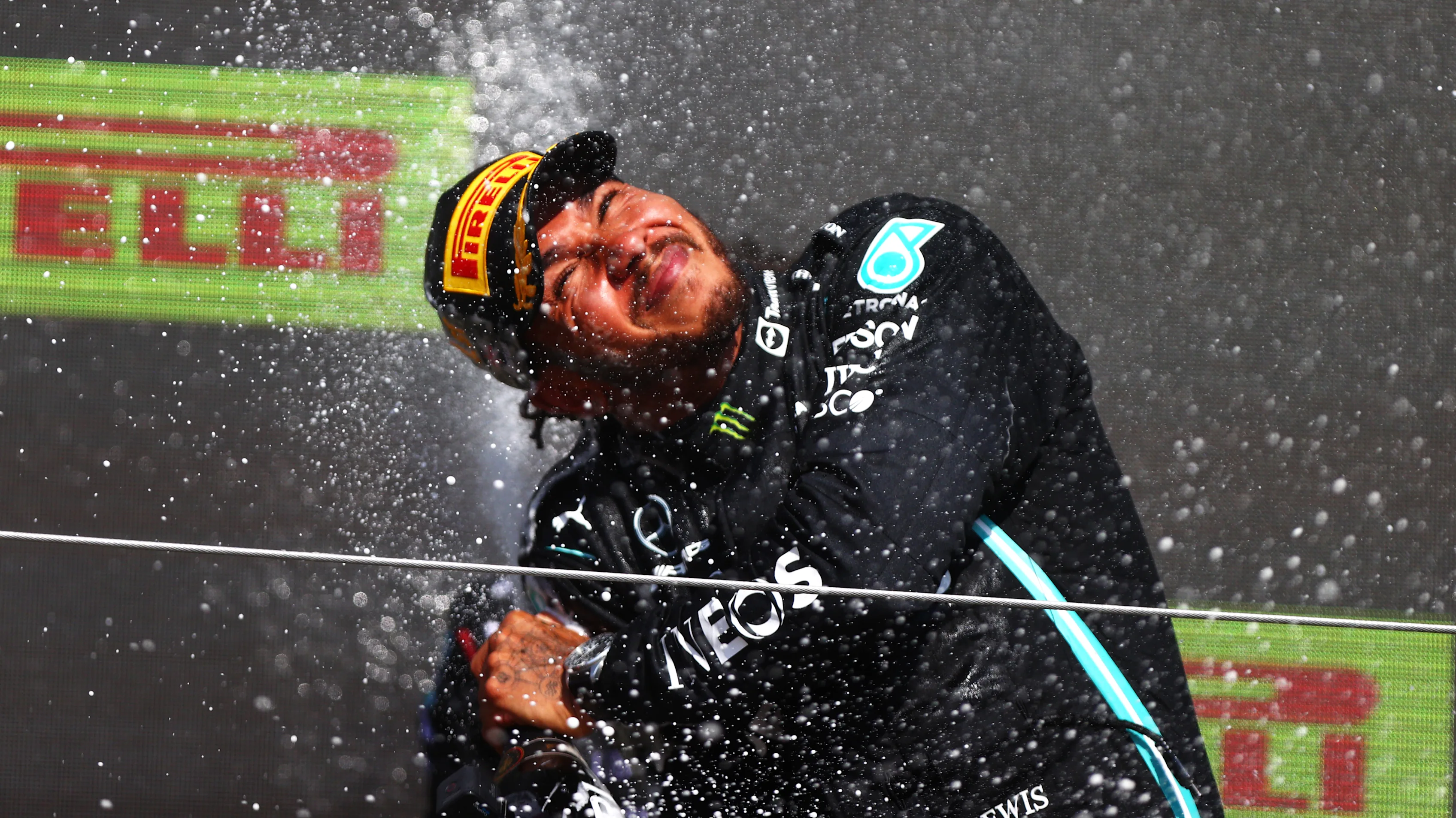 NORTHAMPTON, ENGLAND - JULY 18: Race winner Lewis Hamilton of Great Britain and Mercedes GP celebrates on the podium during the F1 Grand Prix of Great Britain at Silverstone on July 18, 2021 in Northampton, England. (Photo by Dan Istitene - Formula 1/Formula 1 via Getty Images)