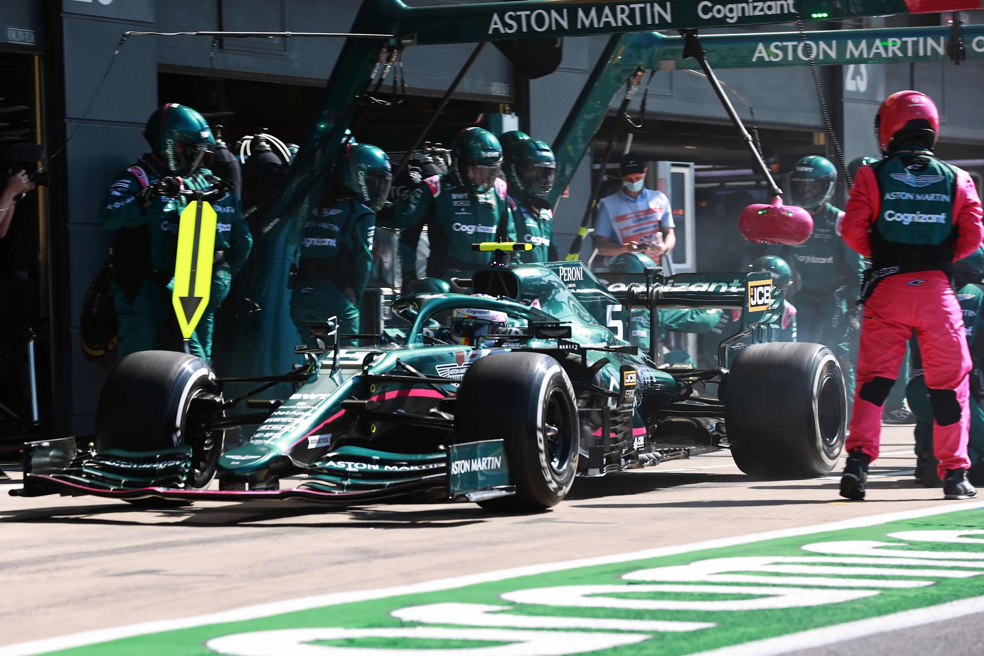 NORTHAMPTON, ENGLAND - JULY 18: Sebastian Vettel of Germany driving the (5) Aston Martin AMR21 Mercedes makes a pitstop during the F1 Grand Prix of Great Britain at Silverstone on July 18, 2021 in Northampton, England. (Photo by Mark Thompson/Getty Images)